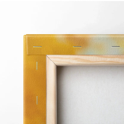 Corner close-up of stretched canvas wall art with wooden frame and vibrant yellow-orange edges.