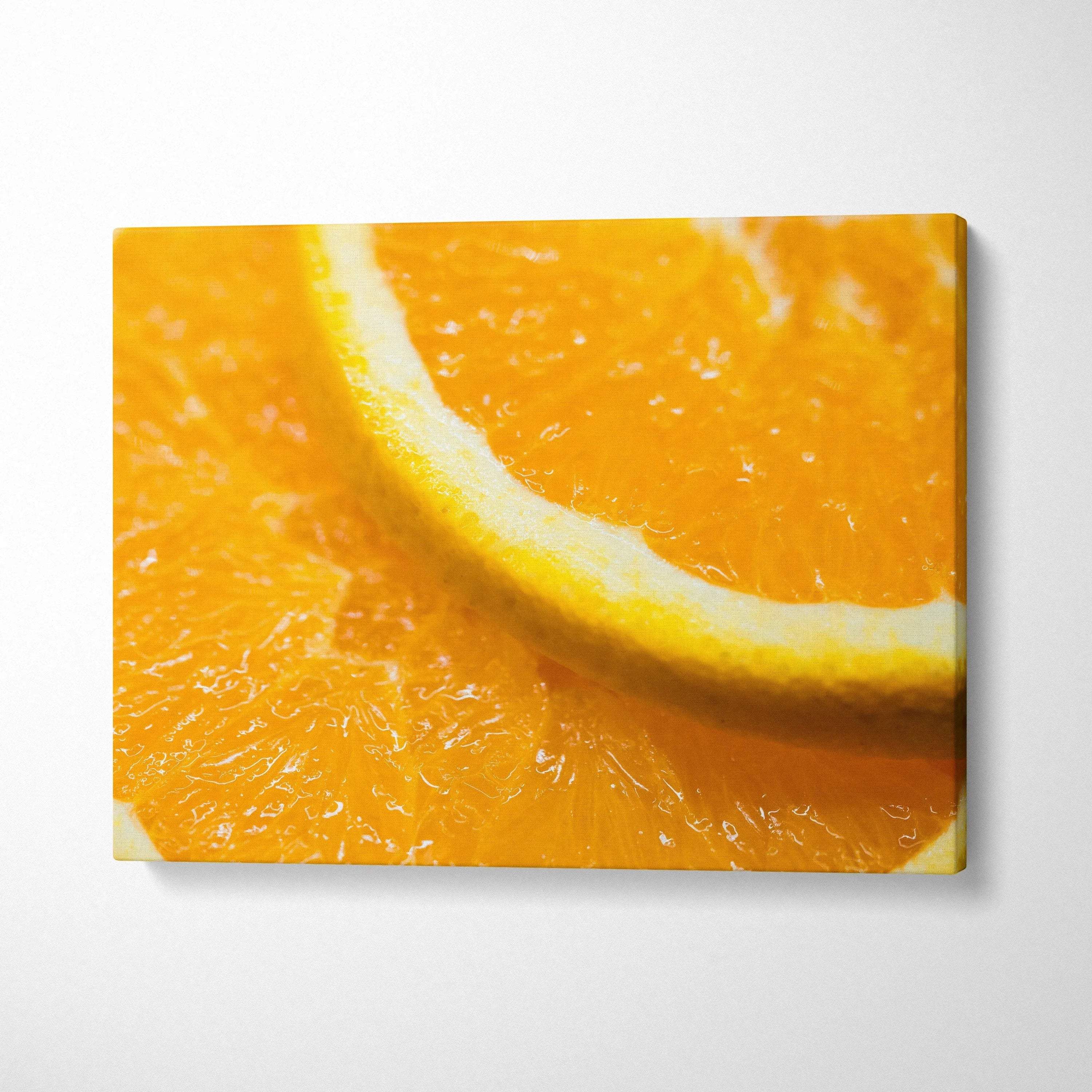 Bright orange slice close-up canvas wall art with vibrant colors for home decor.