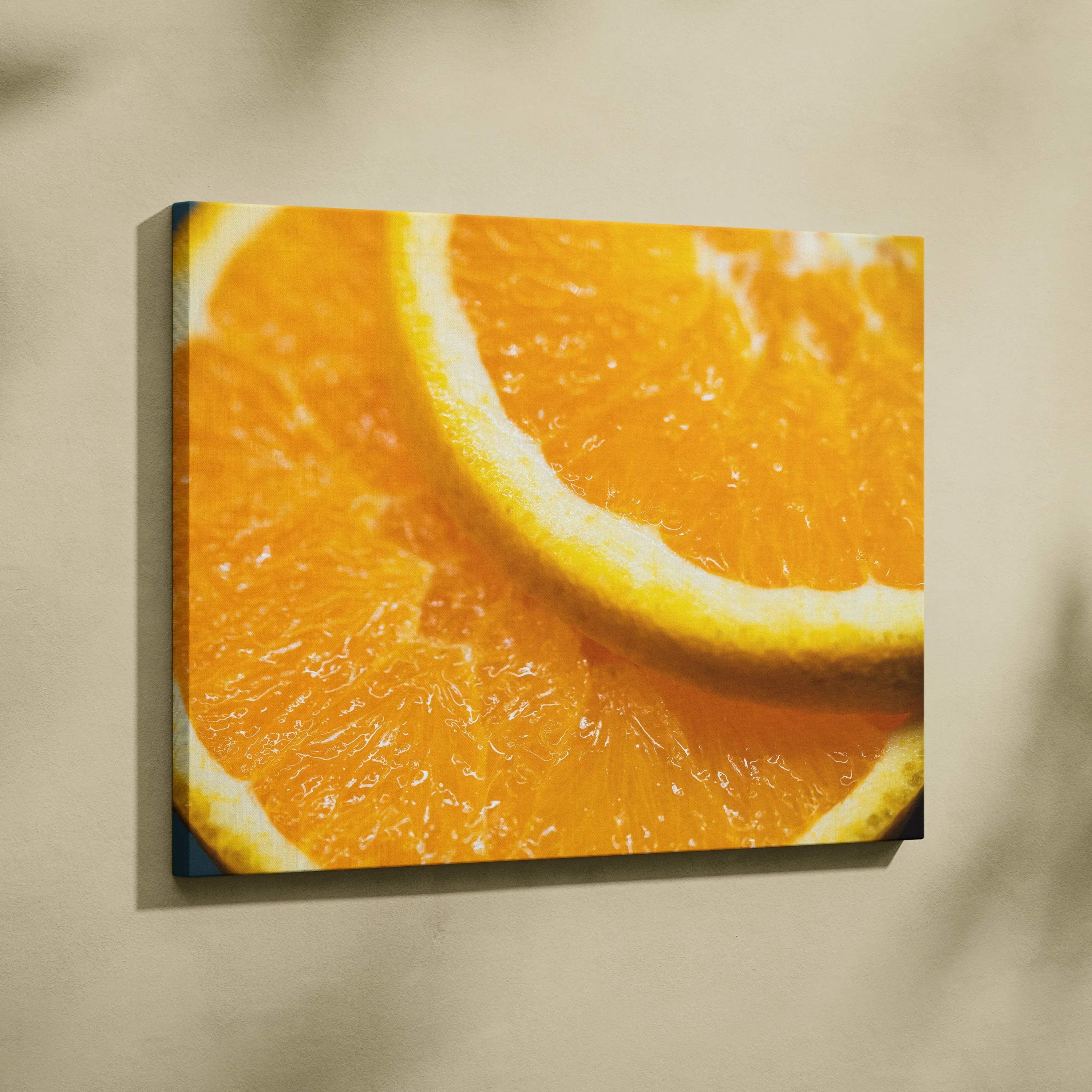 Canvas wall art featuring a vibrant close-up of juicy orange slices in bright, warm tones.