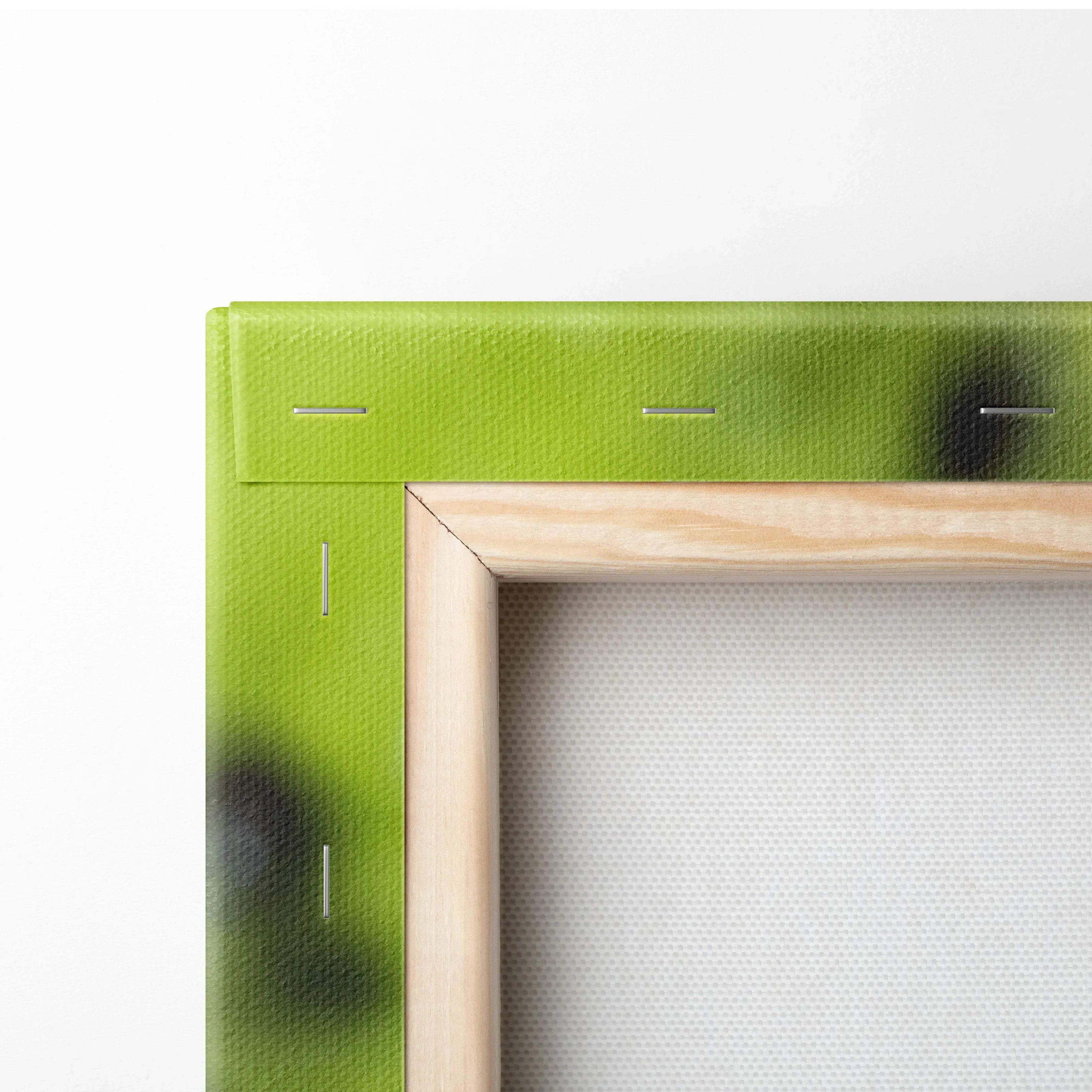 Close-up of wooden frame and green canvas backing with blurred dark spots on wall art canvas panel.