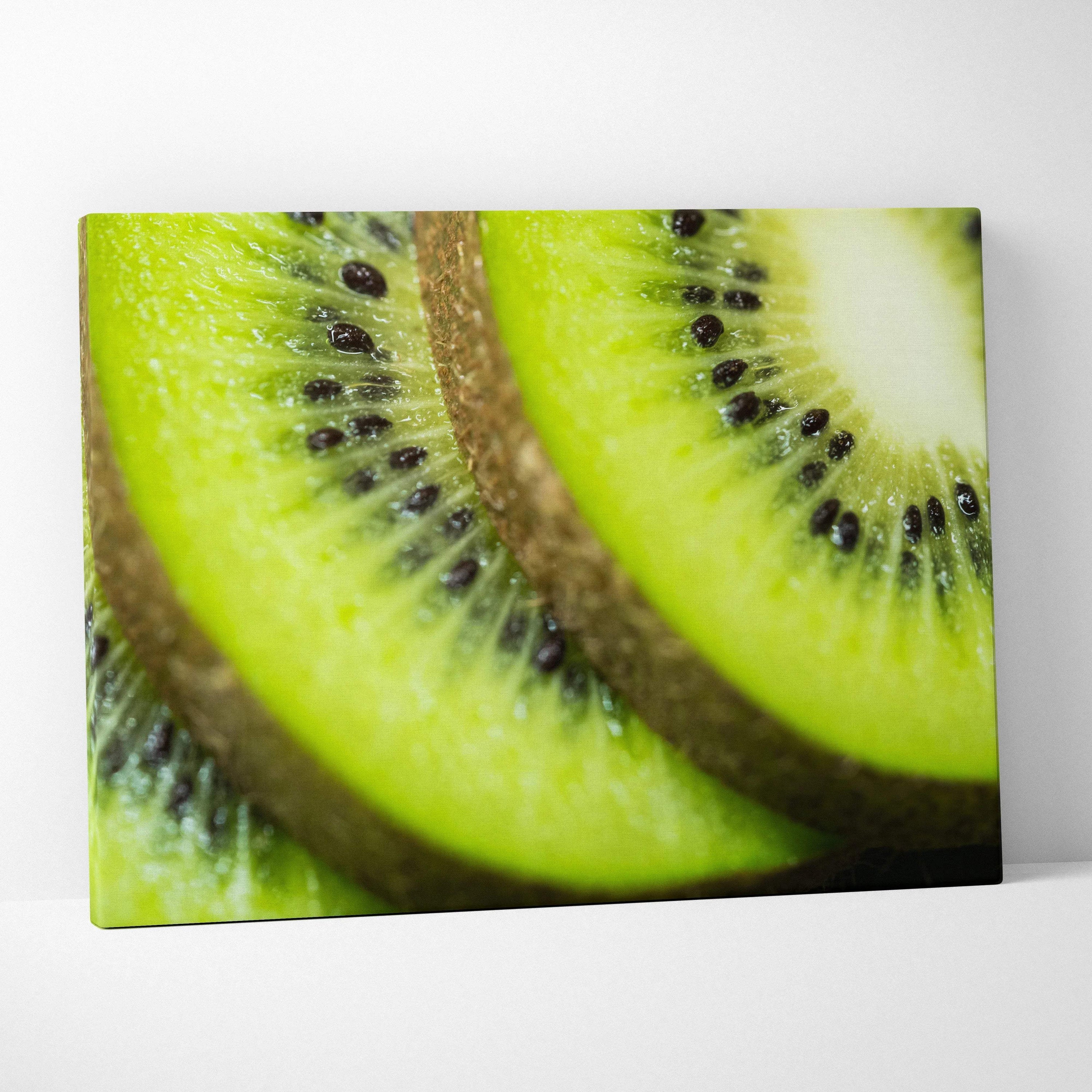 High-resolution canvas wall art featuring vibrant close-up of ripe green kiwi slices with detailed seeds and texture.