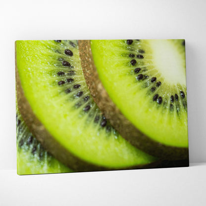High-resolution canvas wall art featuring vibrant close-up of ripe green kiwi slices with detailed seeds and texture.