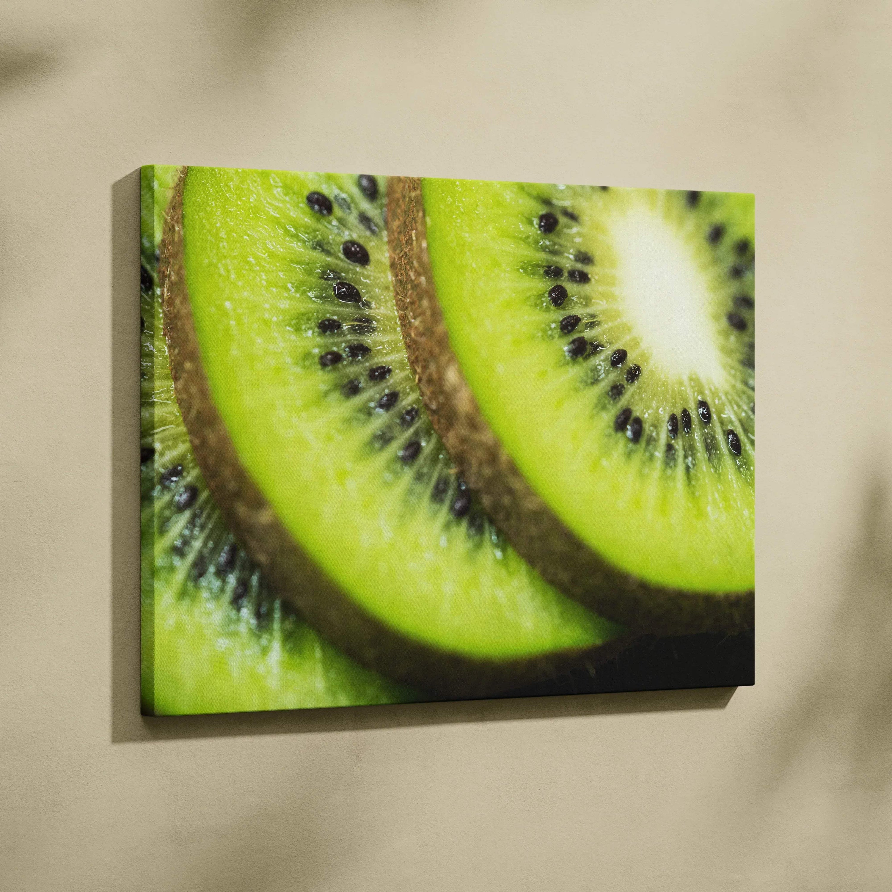 High-resolution canvas wall art featuring close-up of vibrant green ripe kiwi slices with black seeds and textured brown.