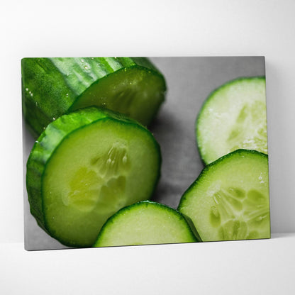 Canvas wall art featuring vibrant close-up of sliced cucumbers with rich green hues and detailed texture.