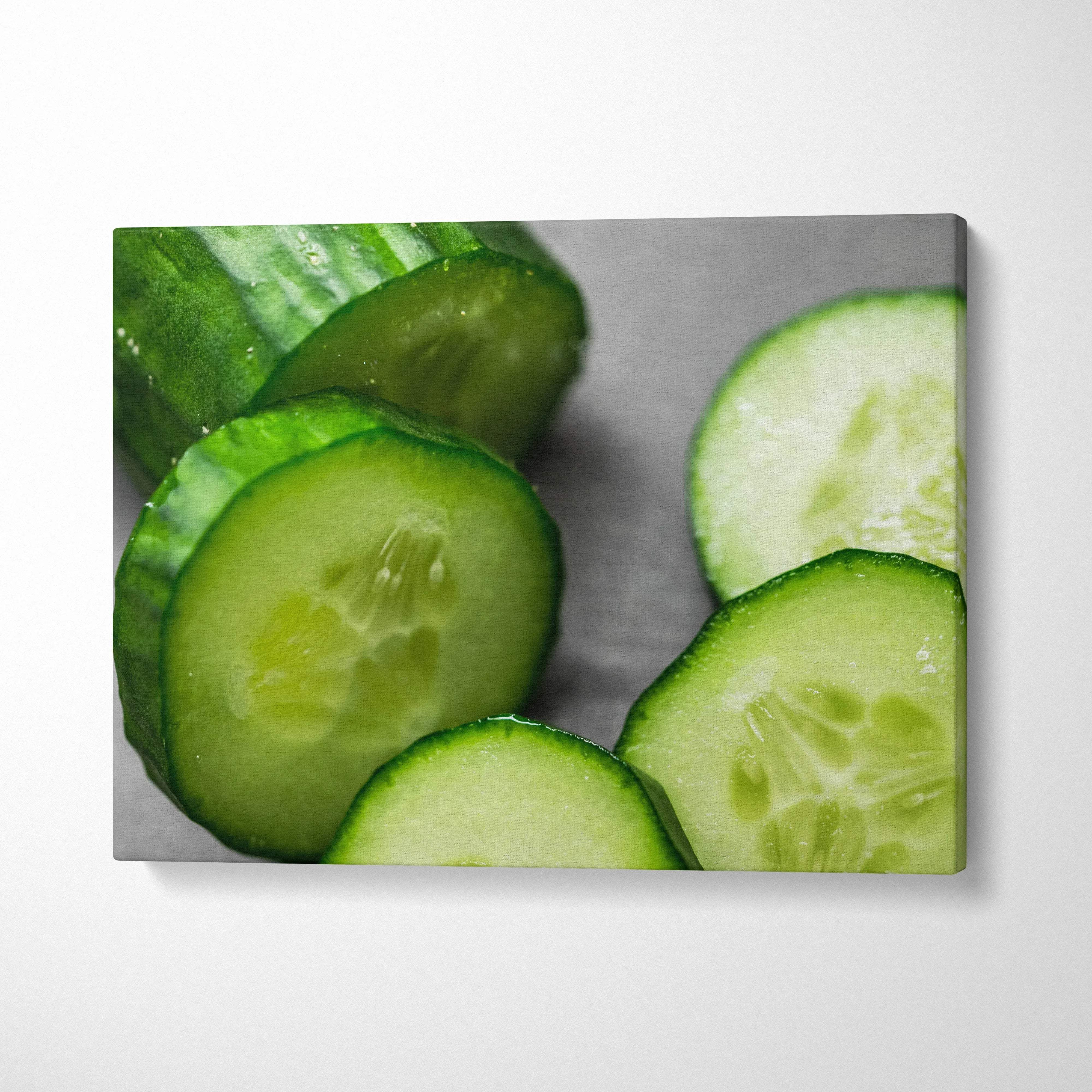Vibrant cucumber close-up on canvas wall art with fresh green decor detail.