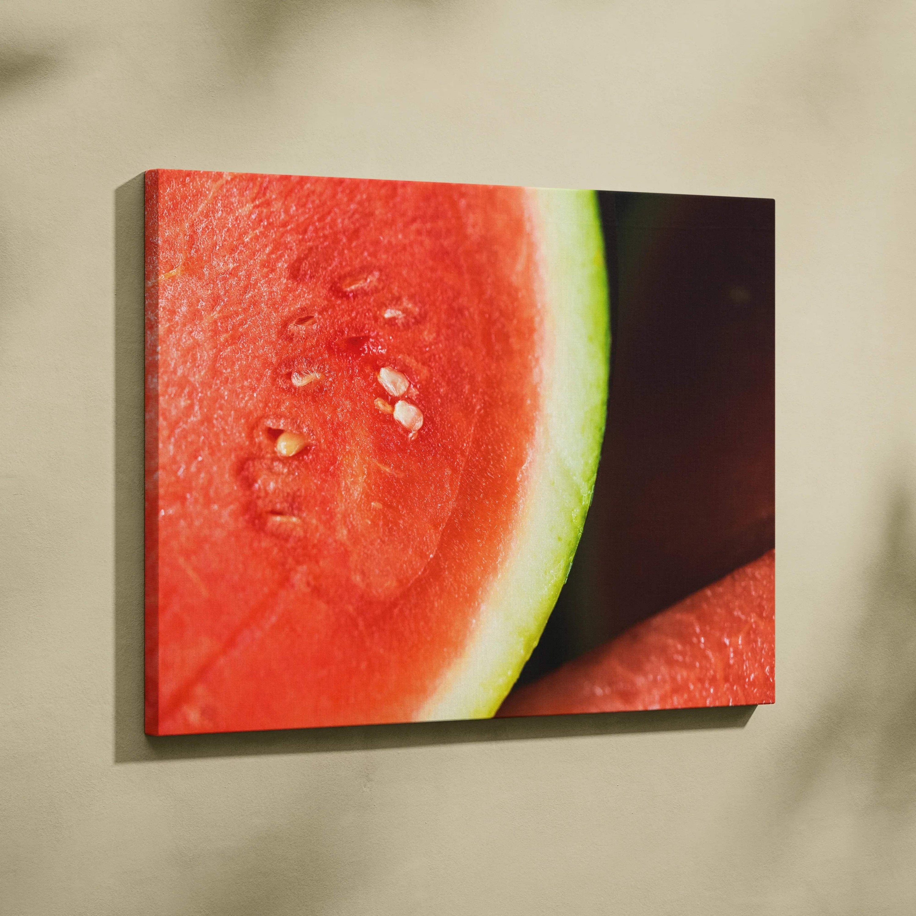 Close-up canvas wall art featuring vibrant red watermelon slice with green rind and visible seeds, ideal for colorful home.