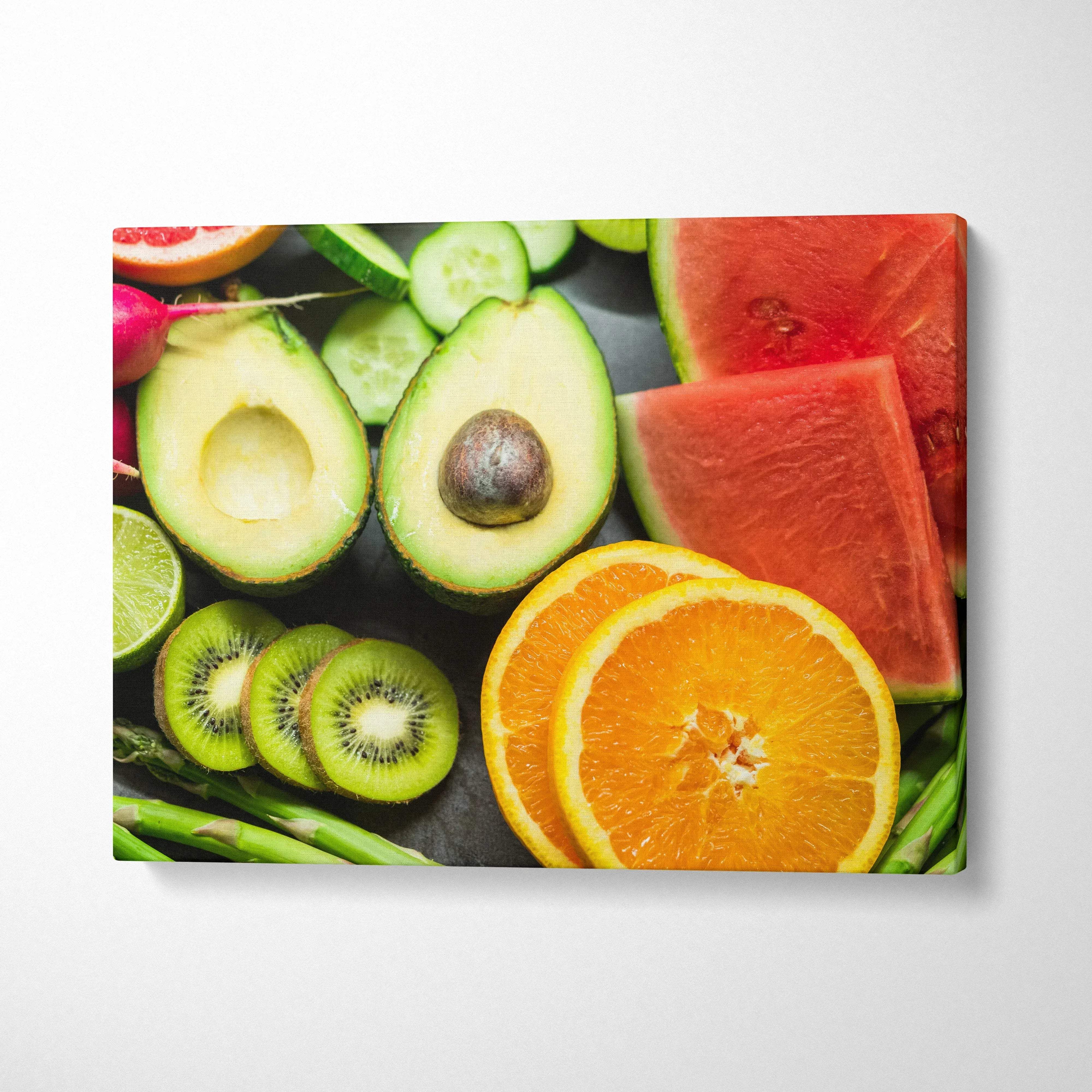 Canvas wall art featuring vibrant fresh fruit plate with oranges, watermelon, kiwi, and avocado for home decor.