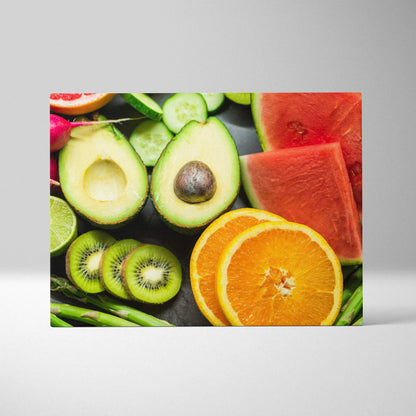 Colorful canvas wall art featuring sliced oranges, watermelon, kiwi, avocado, and cucumber on black background.