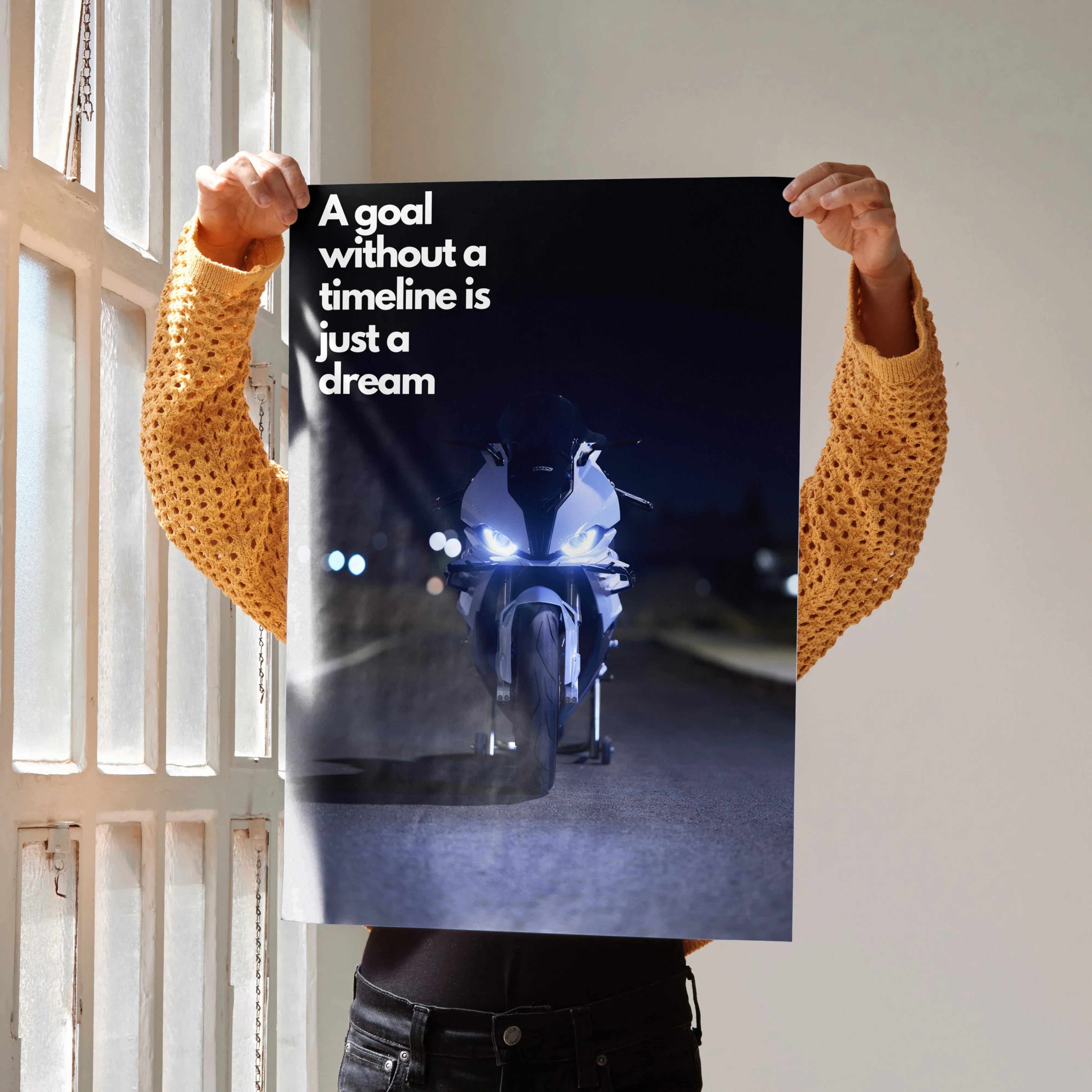BMW S1000RR motorcycle poster with inspirational text "A goal without a timeline is just a dream" wall art in dark tones.