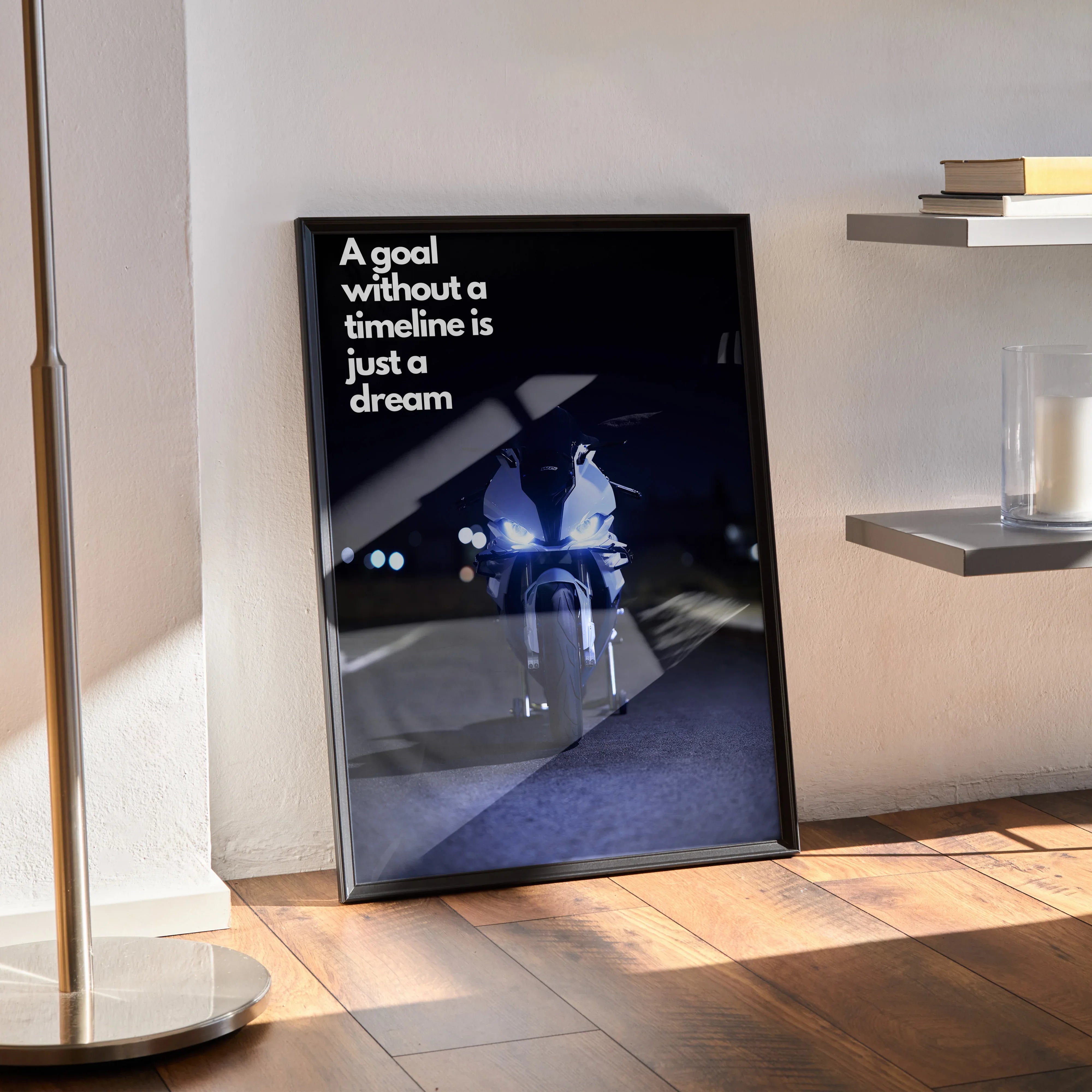 Motivational poster wall art with BMW S1000RR inspired text "A goal without a timeline is just a dream" in black frame.