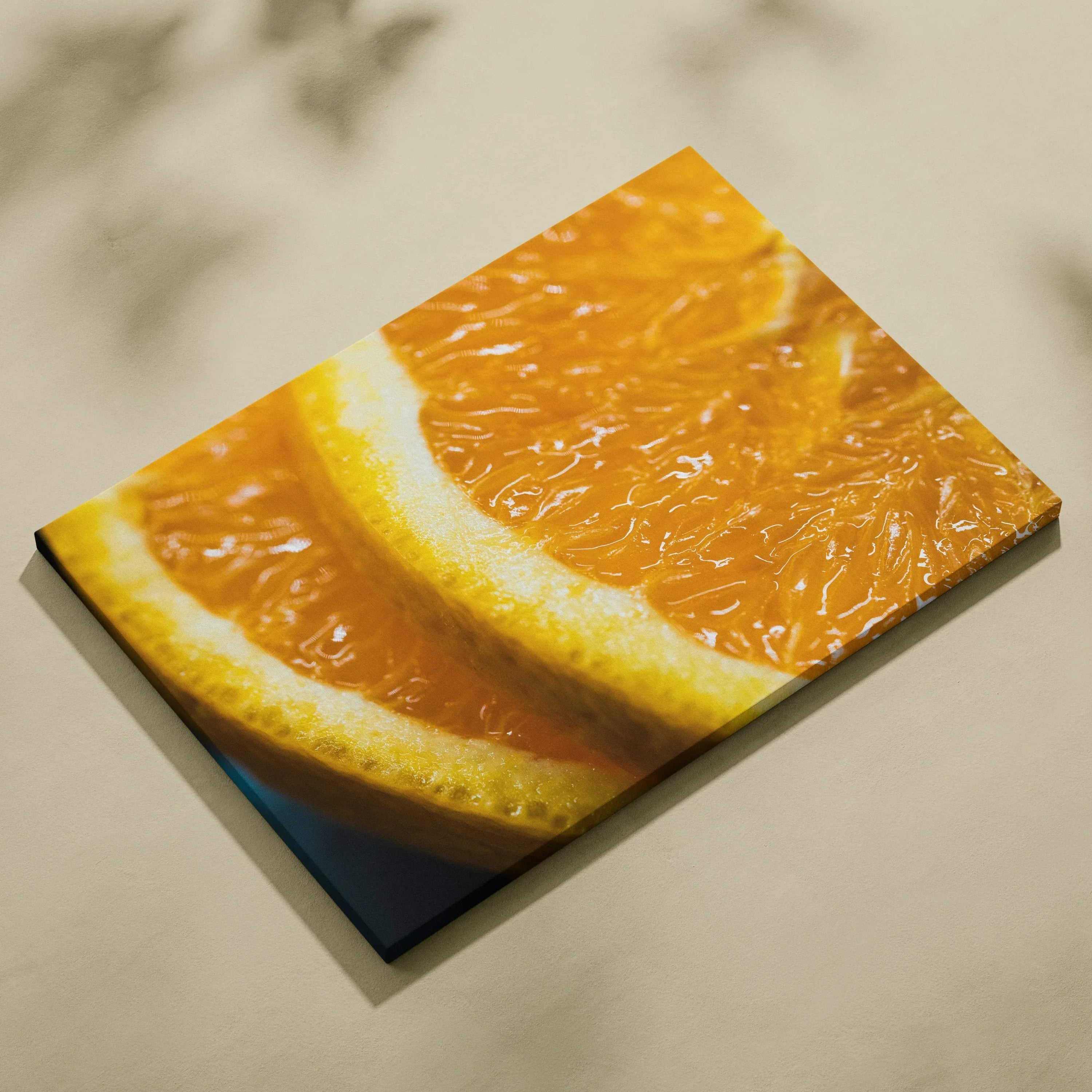 Close-up canvas wall art featuring vibrant orange slices with detailed texture and bright colors for home decor.