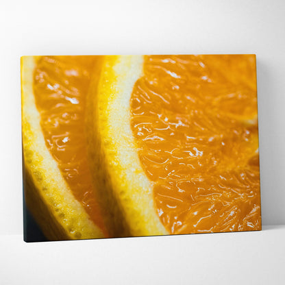 Close-up canvas wall art print featuring vibrant orange slices with detailed texture and glossy surface.