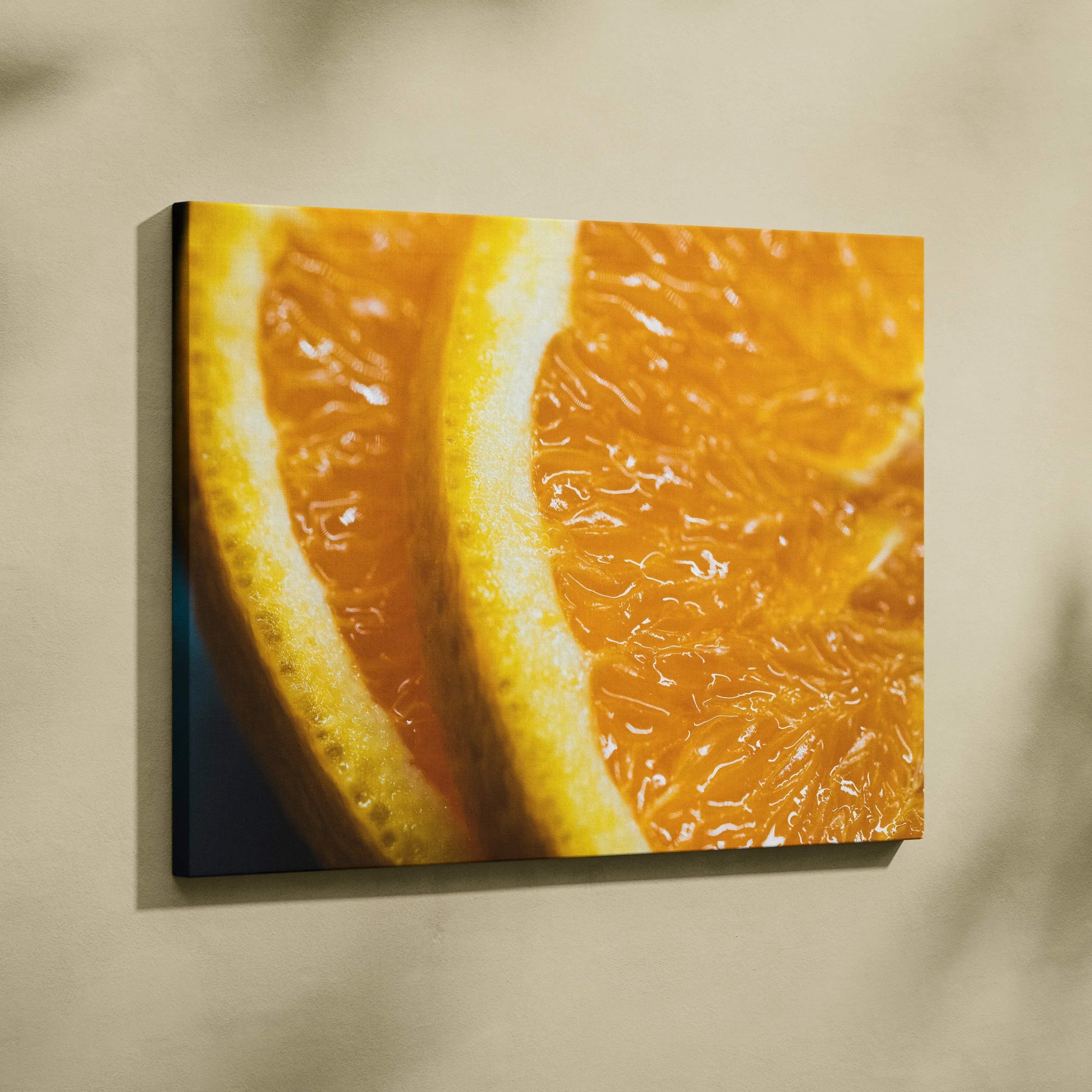 Vibrant orange slice close-up canvas wall art with glossy texture for bright home decor.