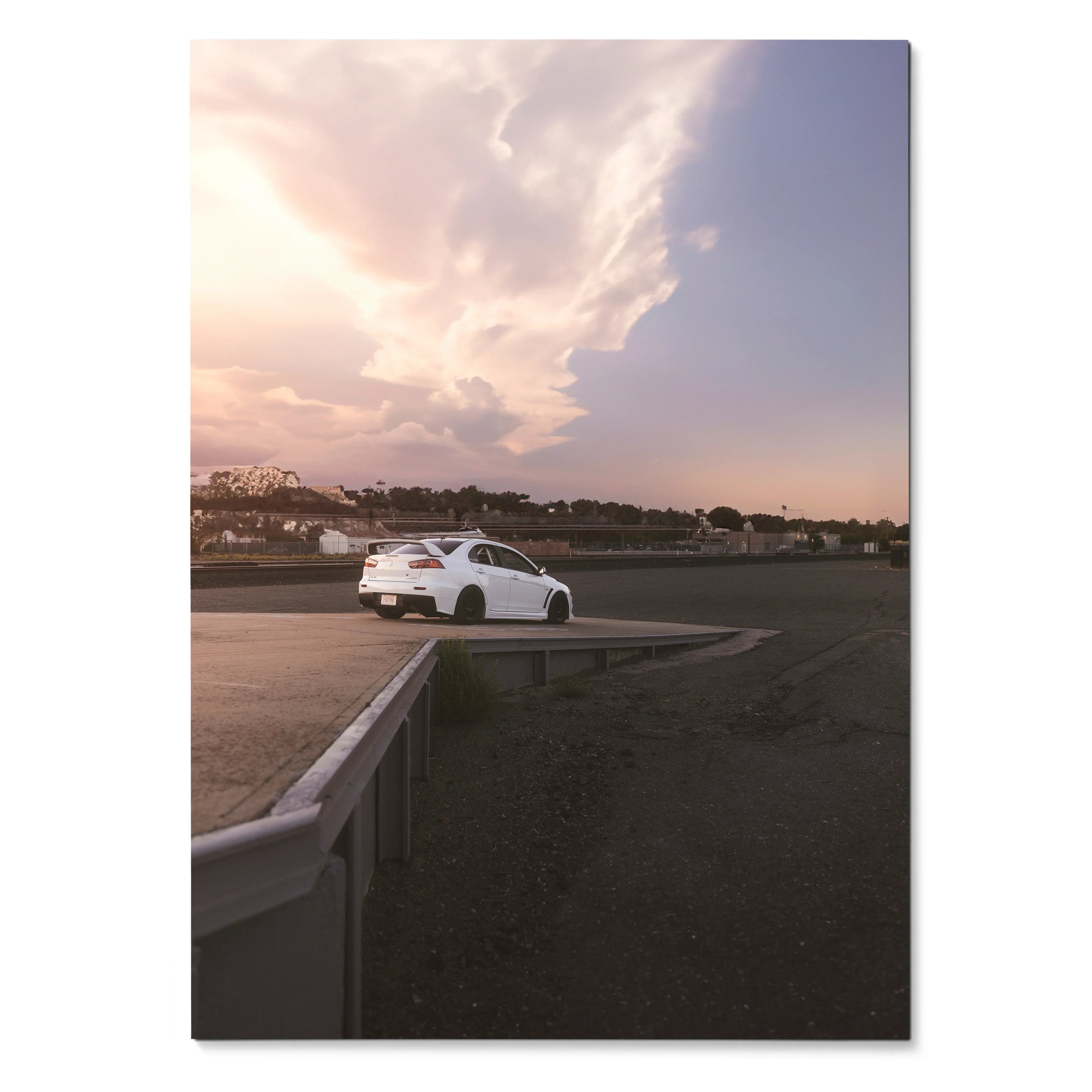 Mitsubishi Evo 10 white car parked on empty road under dramatic sunset sky poster wall art.