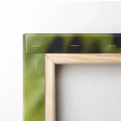 Close-up of wooden frame with green-stretched canvas backing for wall art decor.