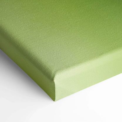Close-up of green canvas stretched over wooden frame with textured surface for wall art decor.