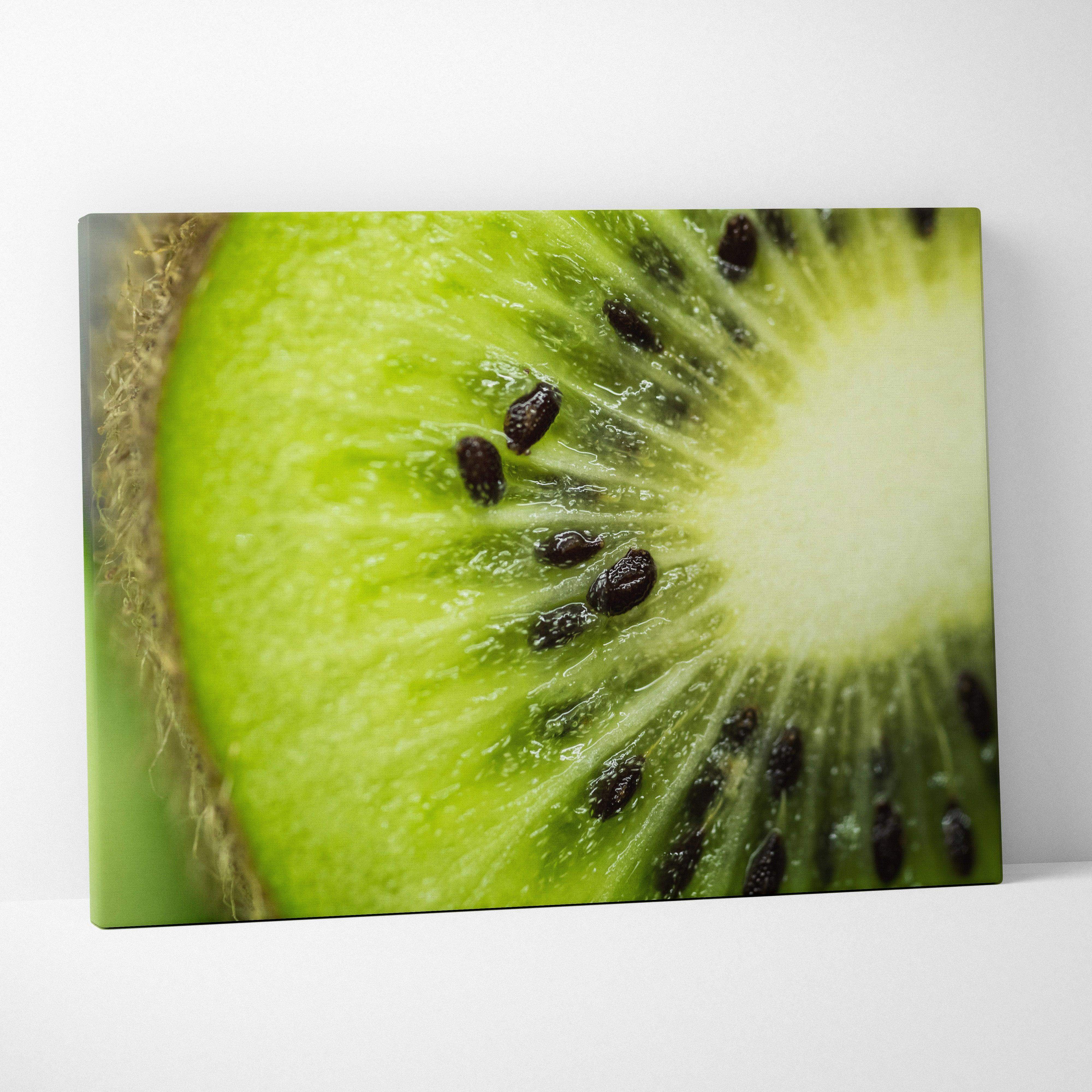 A vibrant green kiwi fruit slice on canvas wall art featuring fresh juicy details for modern home decor