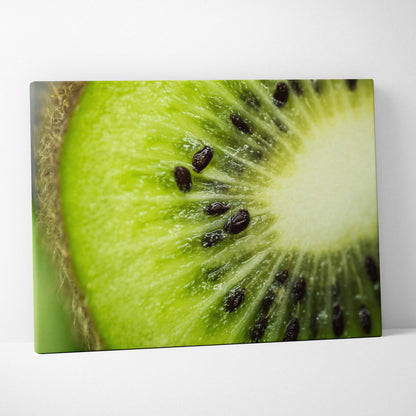 Close-up high-resolution canvas wall art of a vibrant green kiwi slice with visible black seeds and textured skin edge.