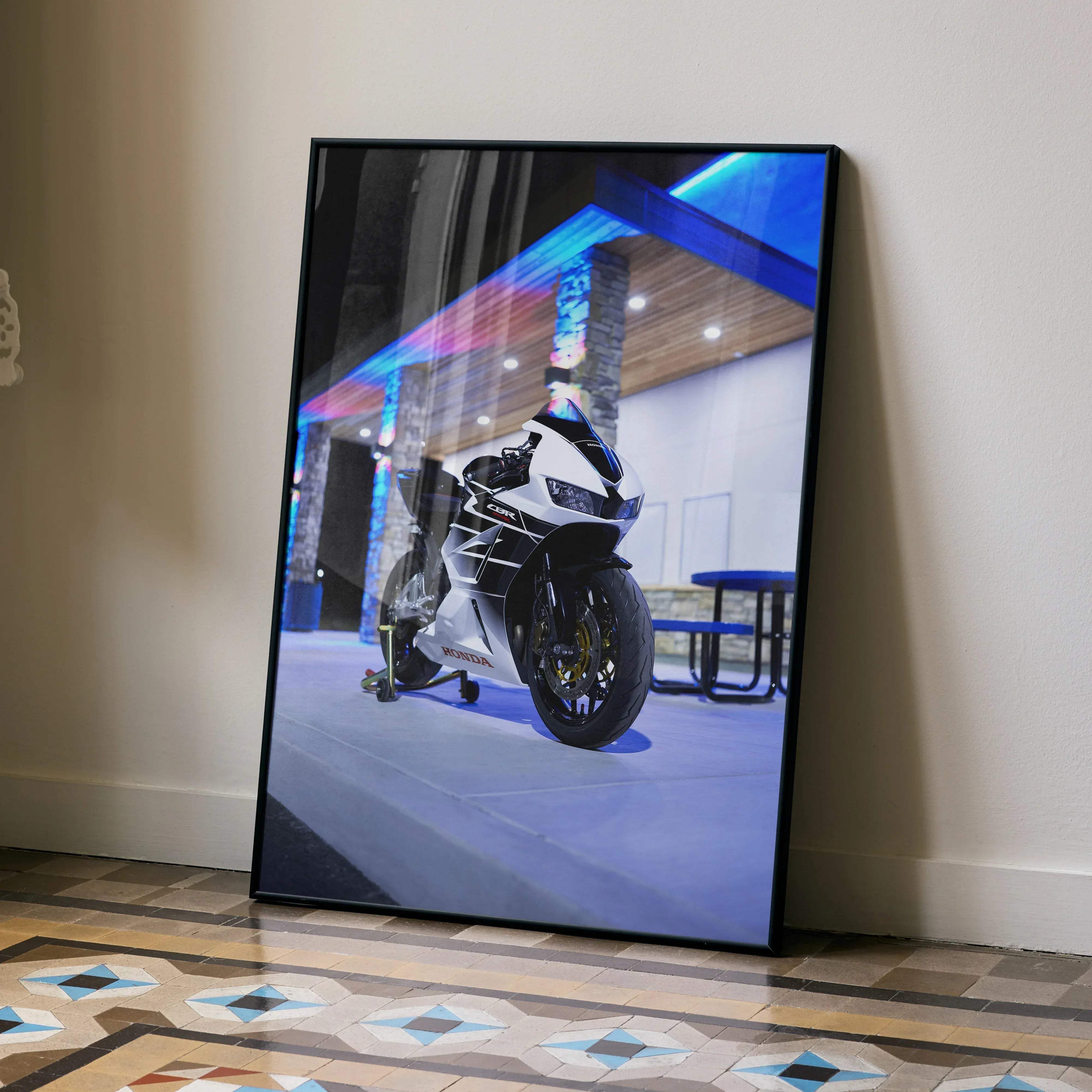 Black-framed Honda CBR600RR motorcycle art poster featuring white and black bike under vibrant blue lighting