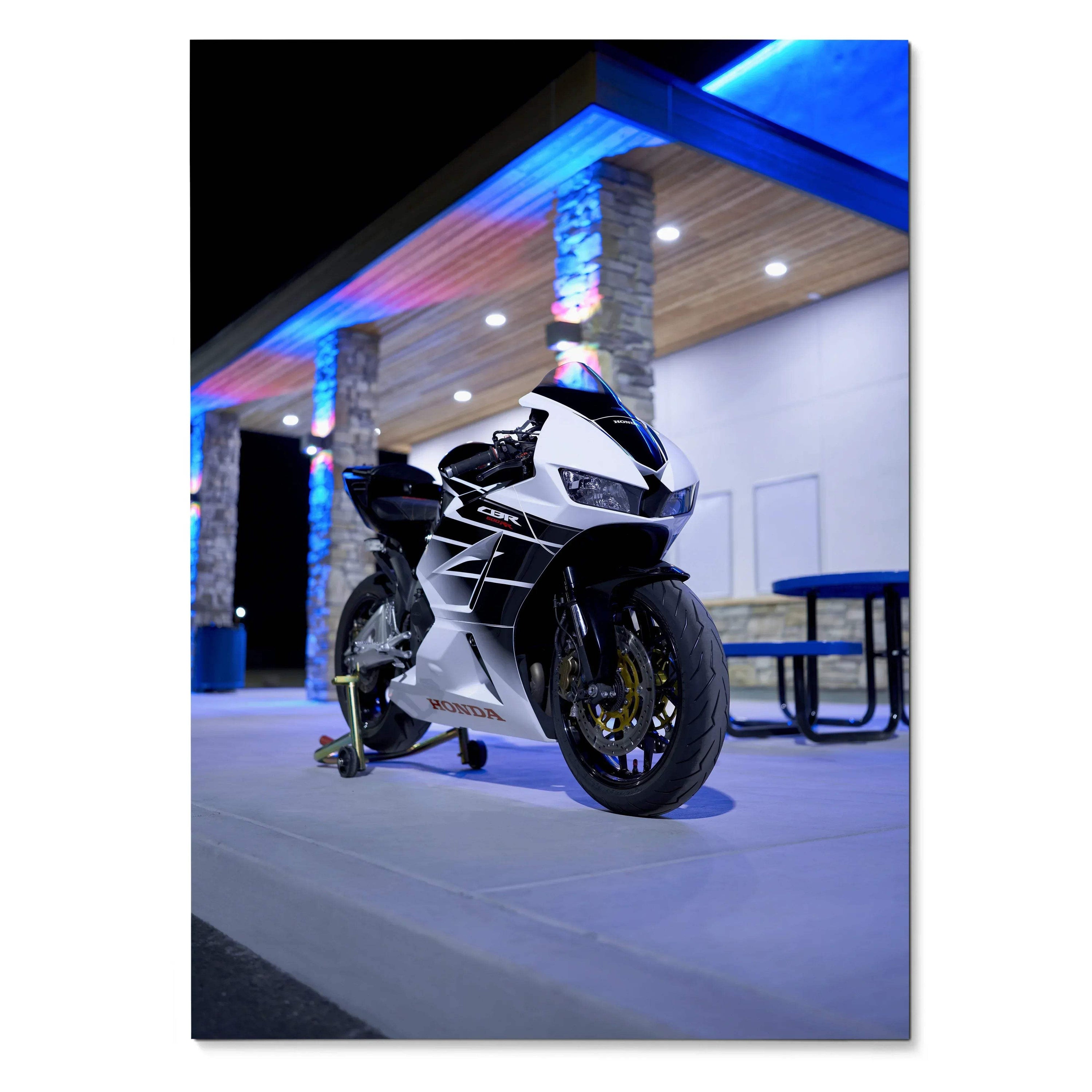 Honda CBR600RR motorcycle poster with sleek black and white sportbike in modern blue-lit setting wall art.