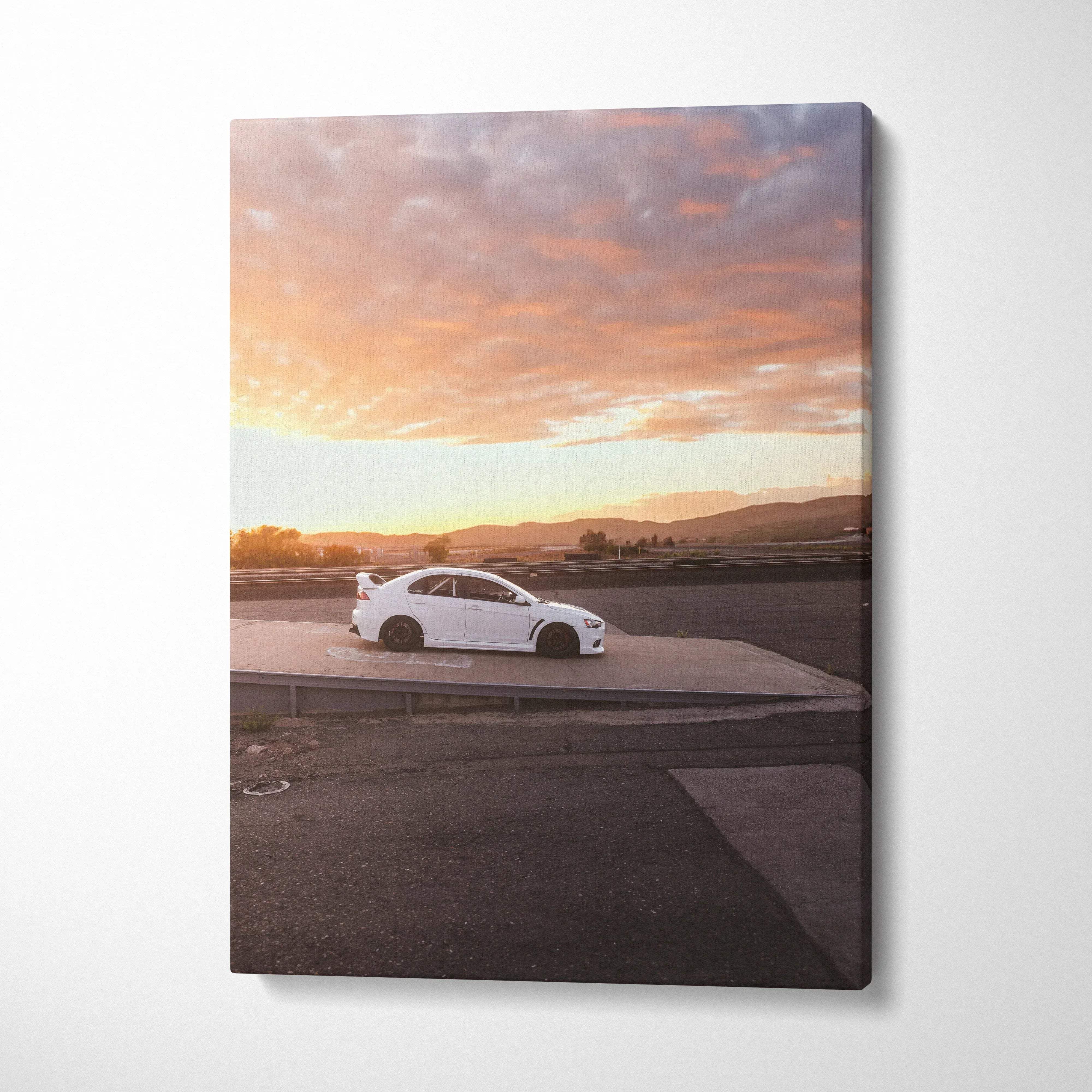 White Mitsubishi Evo 10 car on road at sunset canvas wall art print.