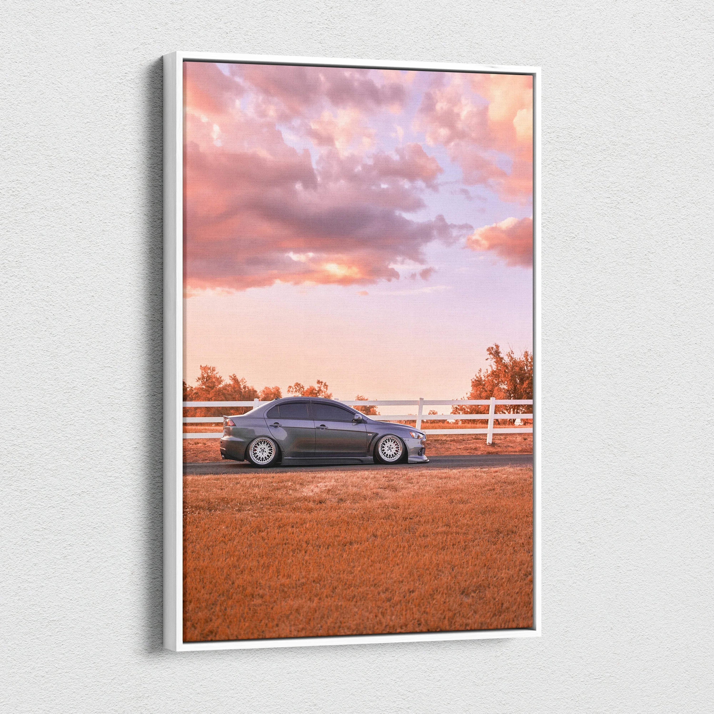 Mitsubishi Evo 10 parked on a dirt road at sunset with vibrant orange sky canvas wall art.