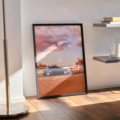 Mitsubishi Evo 10 sports car poster with sunset sky, showcased as wall art in black frame.