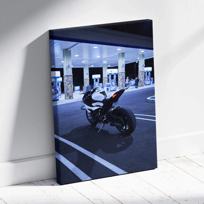 BMW S1000RR motorcycle parked at a gas station at night on vertical canvas wall art.