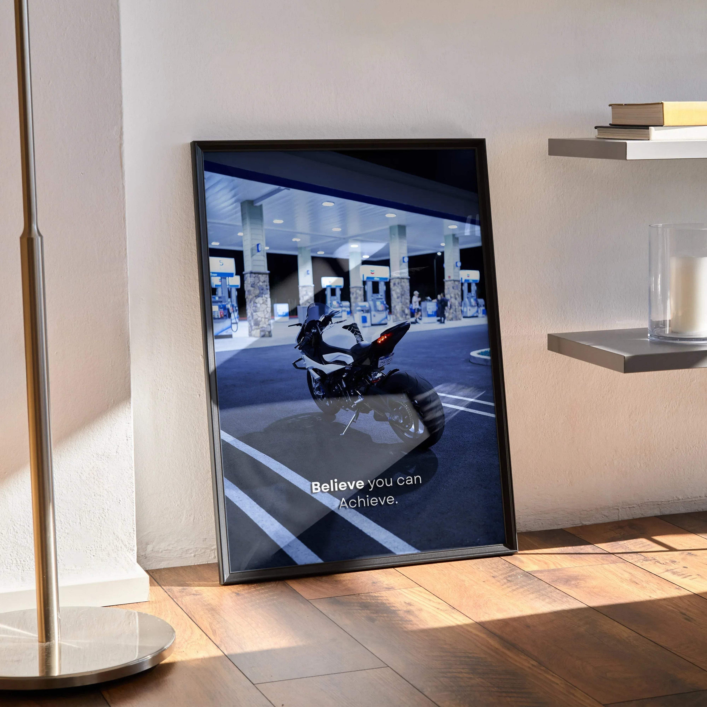 Motivational poster wall art featuring BMW S1000RR motorcycle at gas station with inspiring text.
