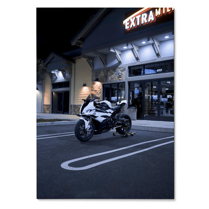 BMW S1000RR motorcycle parked at night outside a lit Extra Mile store poster wall art.