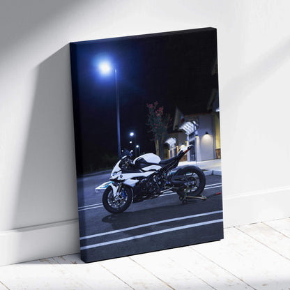 Vertical canvas wall art featuring a BMW S1000RR motorcycle at night with streetlight glow.