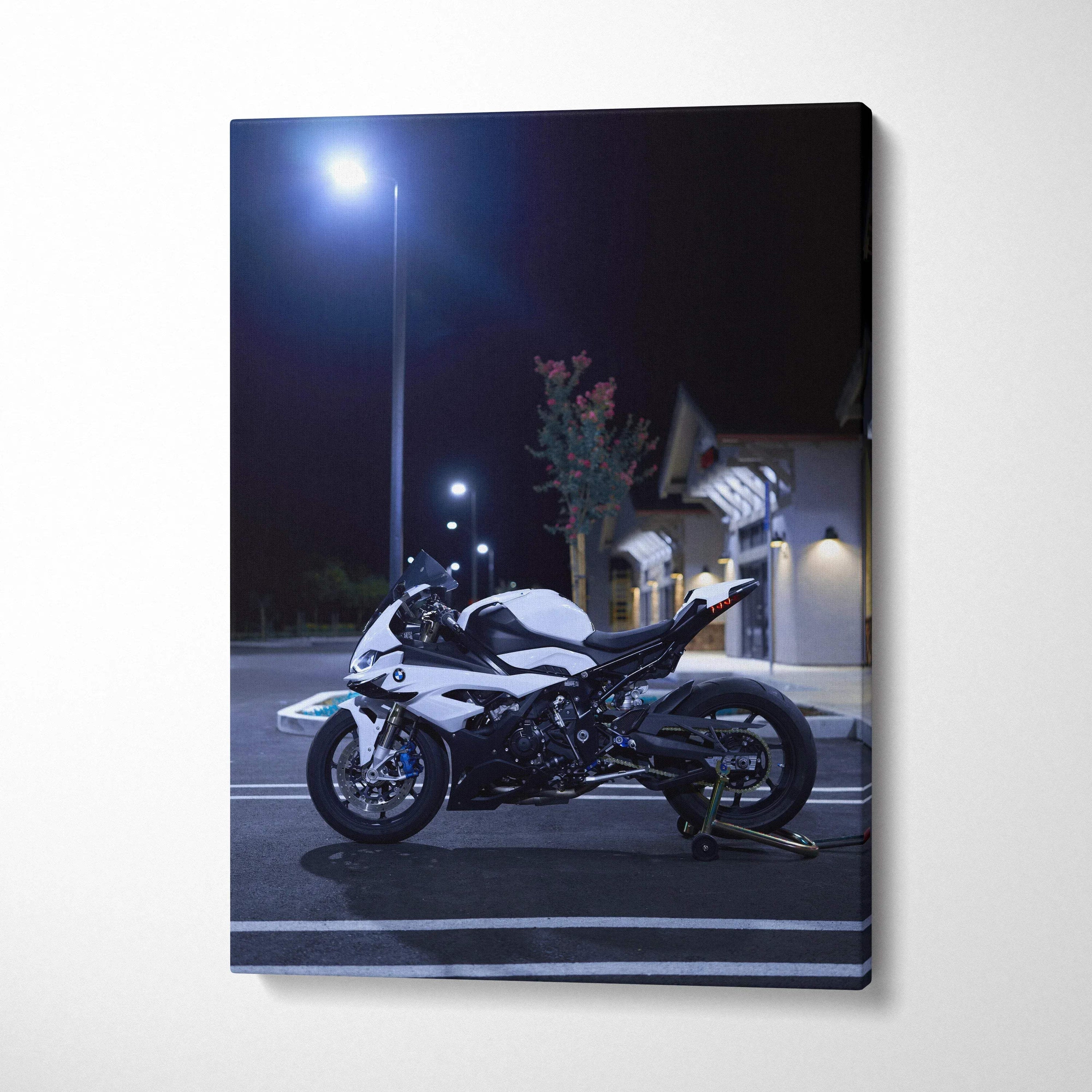 Black and white BMW S1000RR motorcycle at night on vertical canvas wall art.