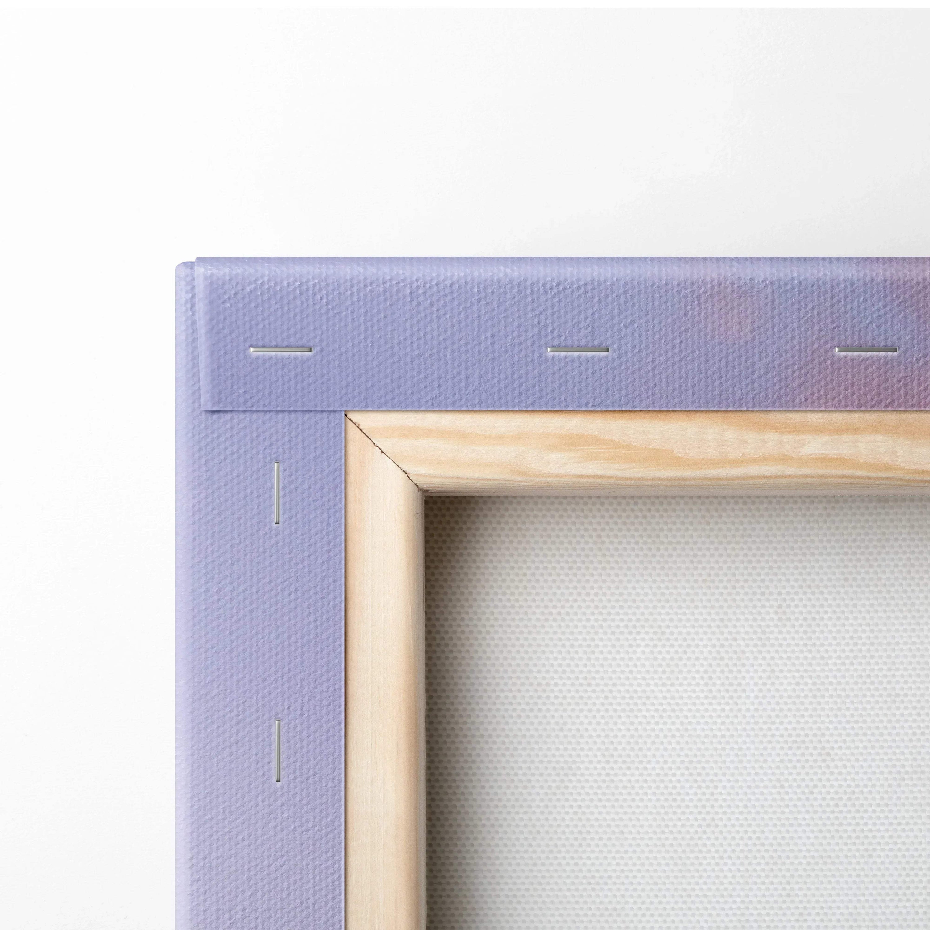 Close-up of wooden frame corner with stretched canvas and purple canvas edge for vertical wall art.