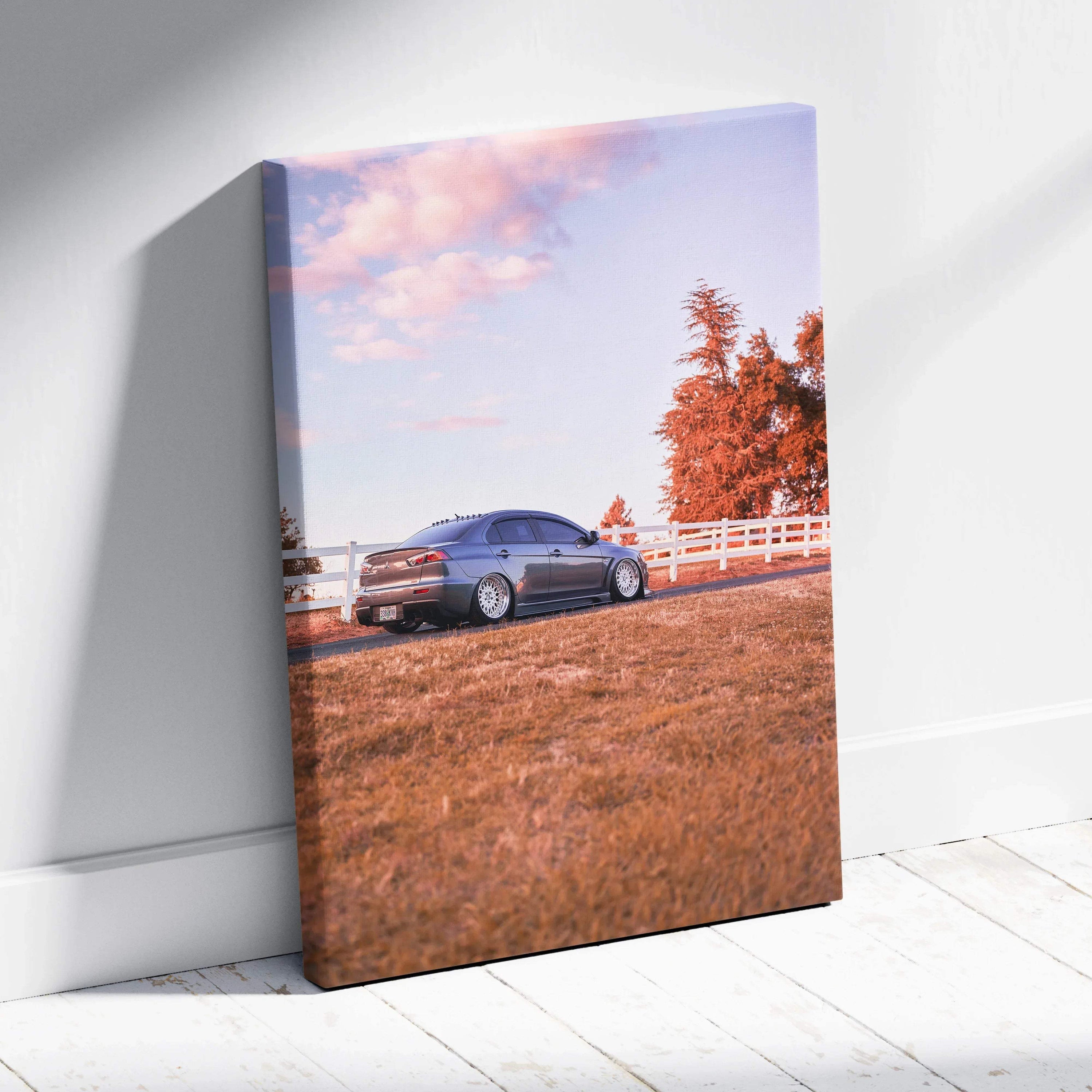 Mitsubishi Evo 10 parked on grassy hill with white fence under pink sunset sky vertical canvas art.