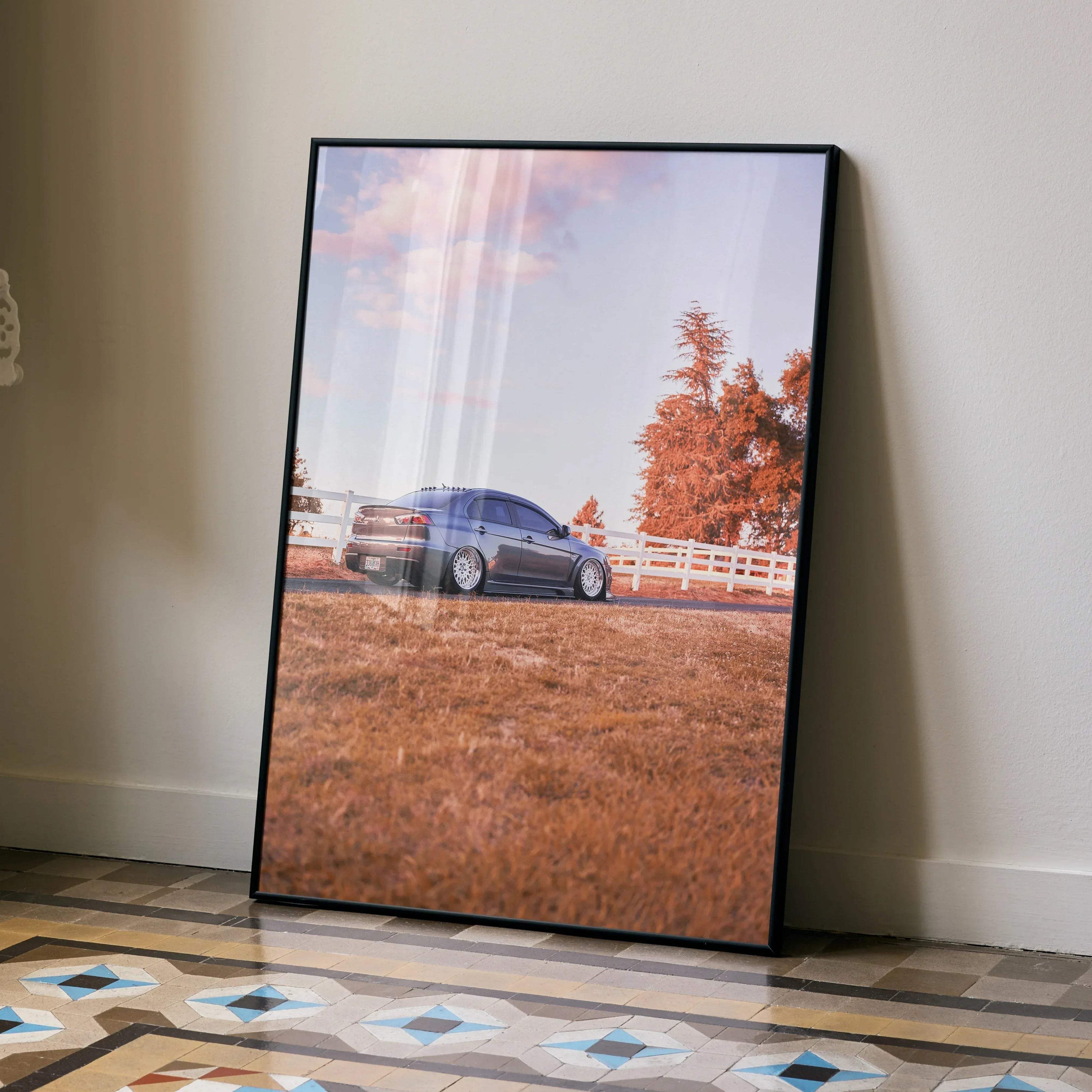 Mitsubishi Evo 10 parked on dry grass with orange trees in the background poster wall art.