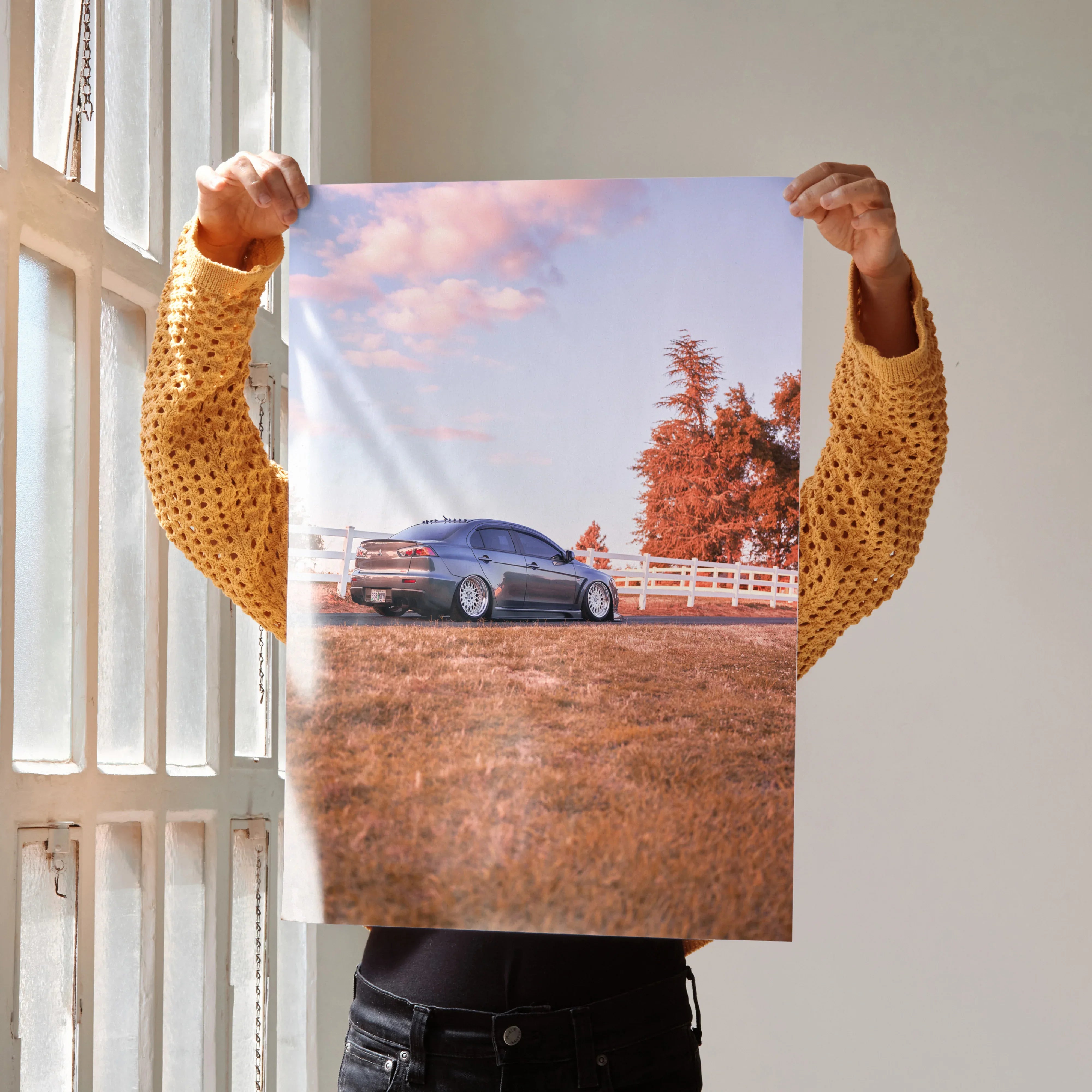 Mitsubishi Evo 10 parked in autumn field with pink sky wall art poster.
