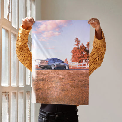 Mitsubishi Evo 10 parked in autumn field with pink sky wall art poster.