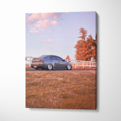 Mitsubishi Evo 10 parked on grassy field with pastel sky on high-resolution vertical canvas wall art.