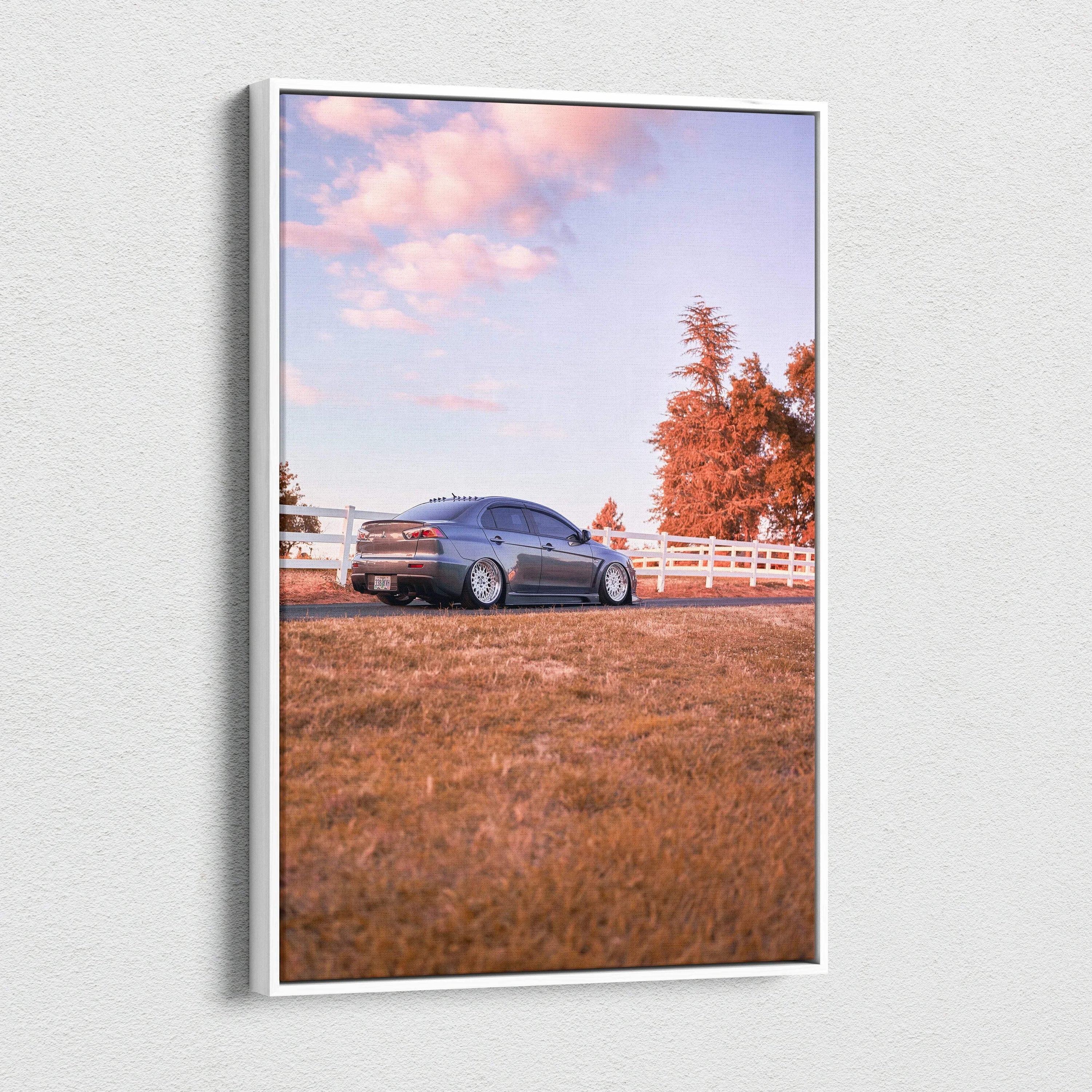 Mitsubishi Evo 10 in blue parked on grass with autumn trees and white fence, vertical canvas art wall decor.