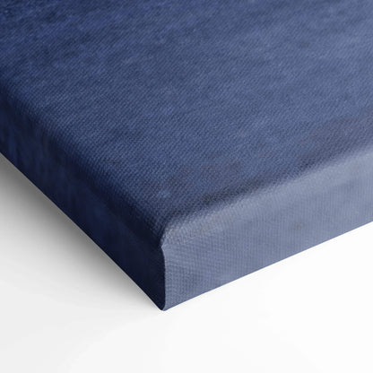 Close-up of deep blue textured canvas art with museum-quality wrap on vertical wall art print.