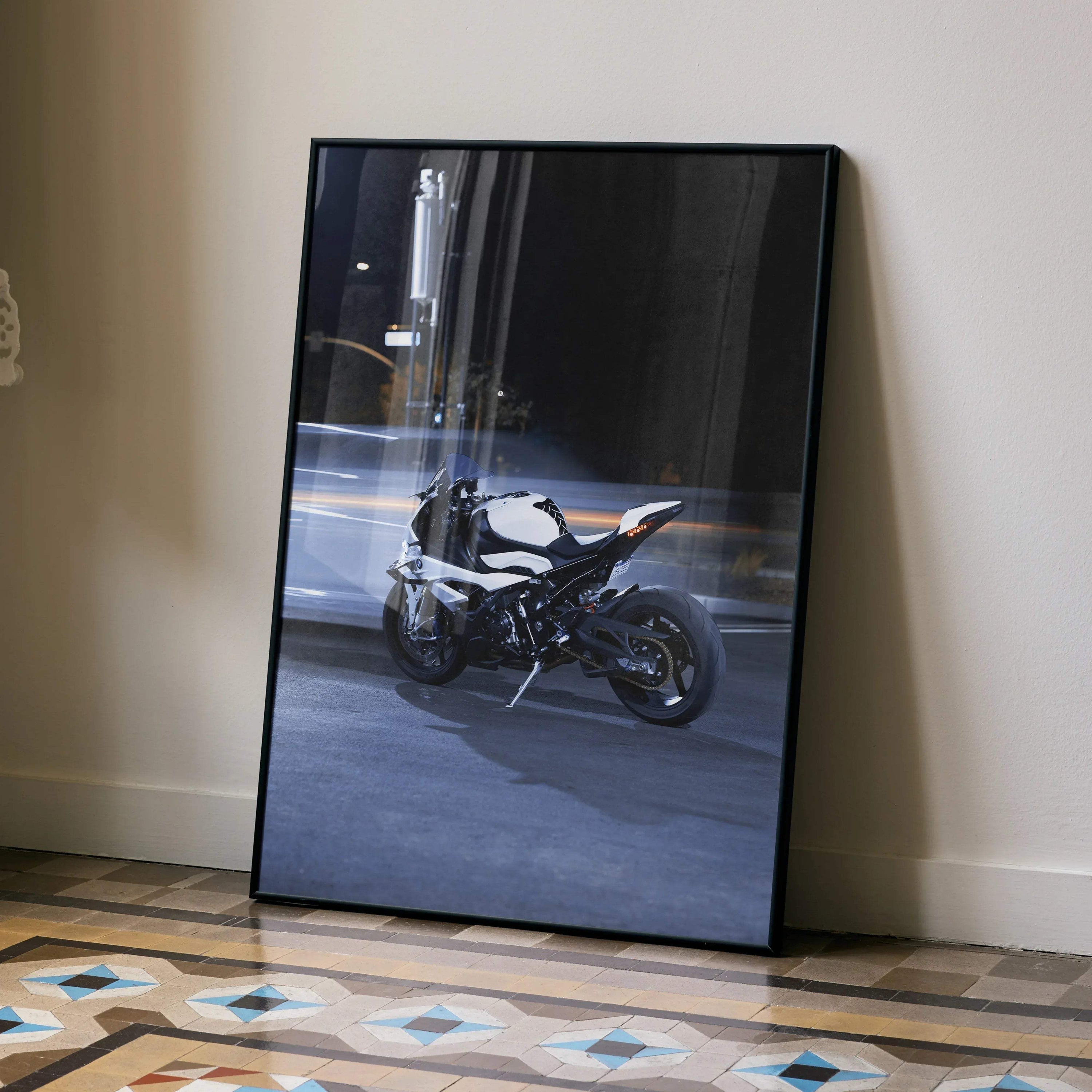 BMW S1000RR motorcycle poster showcasing sleek black and white bike in dynamic urban setting wall art.