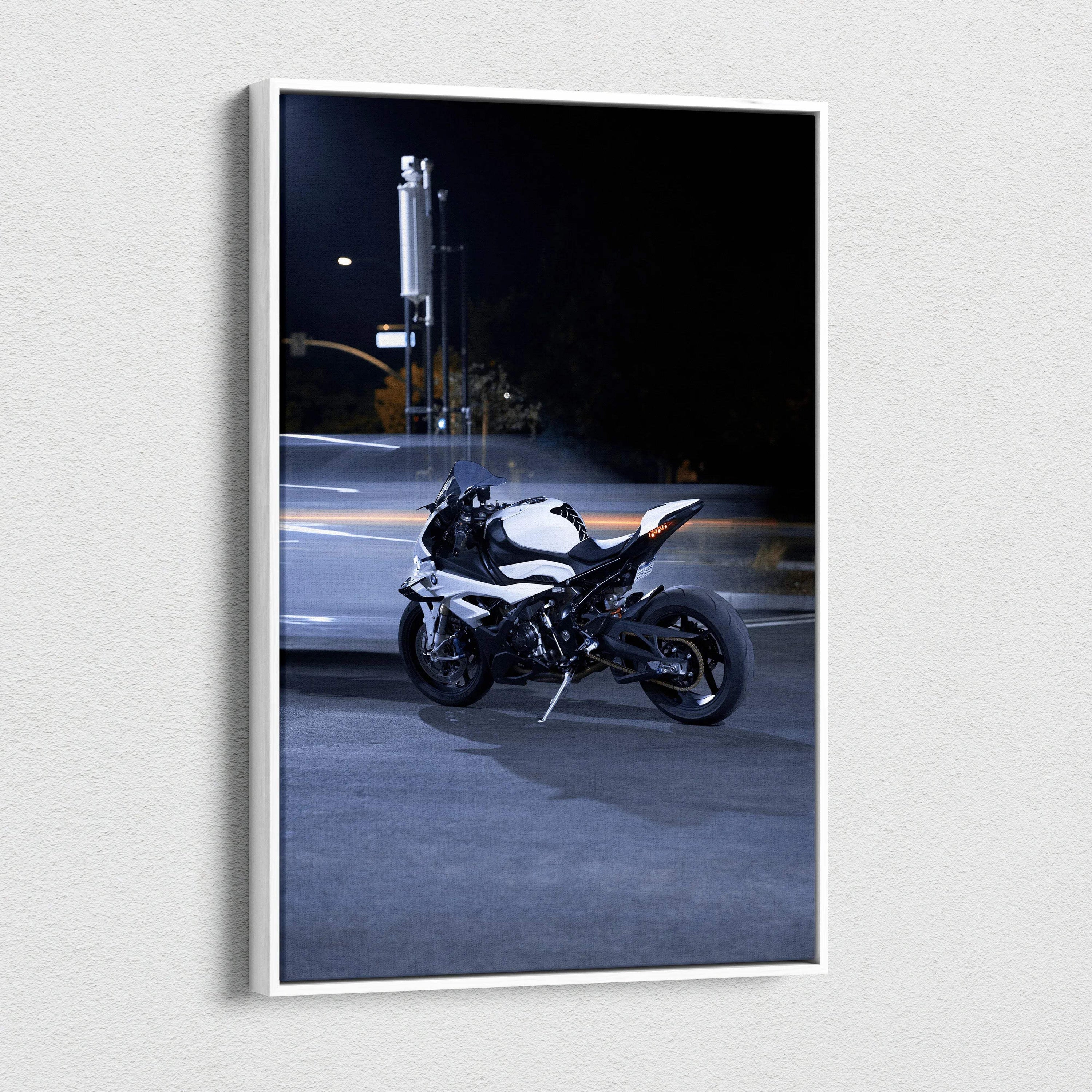 Vertical canvas art of a BMW S1000RR motorcycle parked on a dimly lit urban street at night.