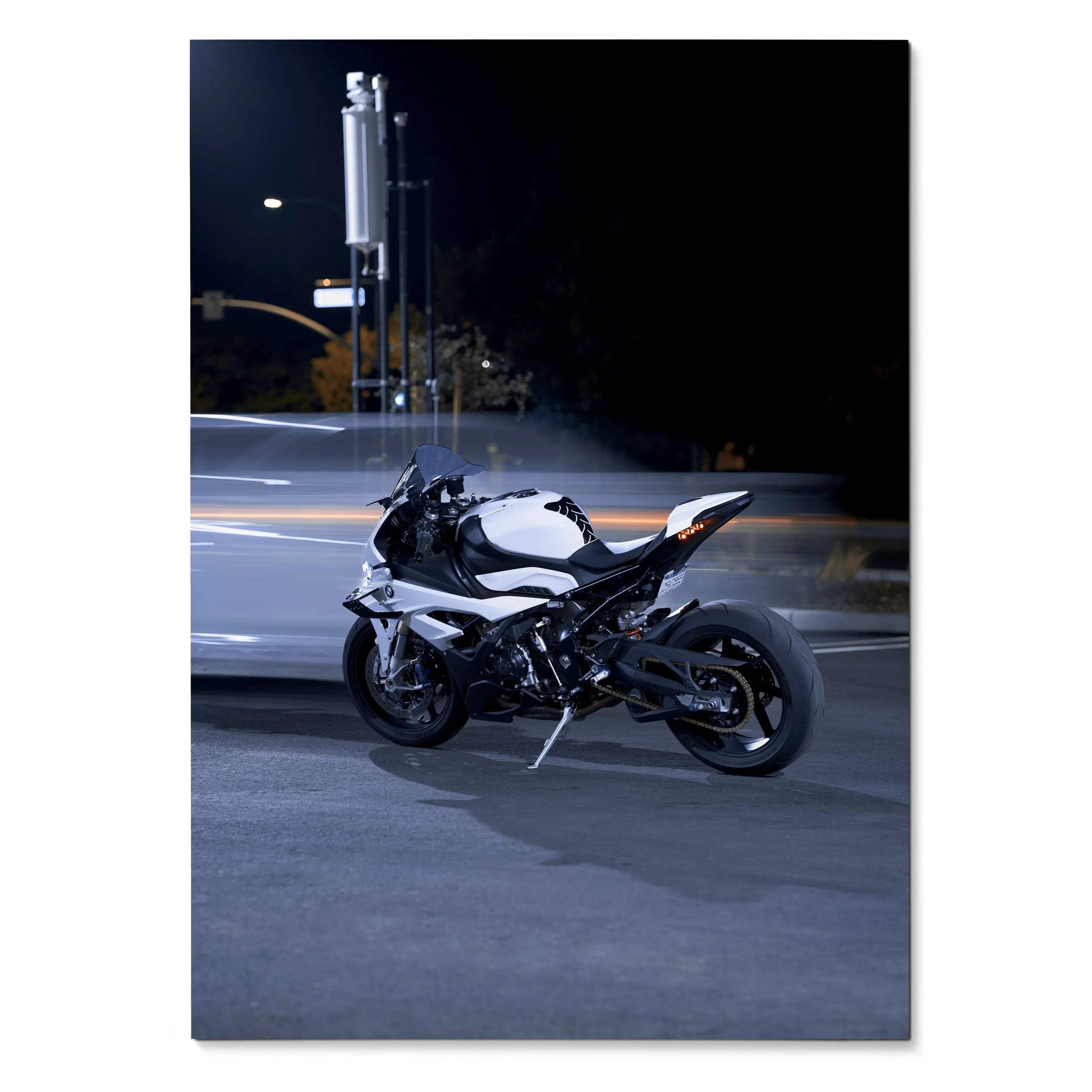 BMW S1000RR motorcycle parked at night with blurred car lights, poster wall art.