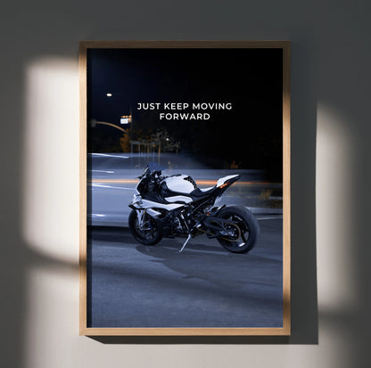 BMW S1000RR motorcycle with "Just Keep Moving Forward" motivational text poster wall art in wooden frame.