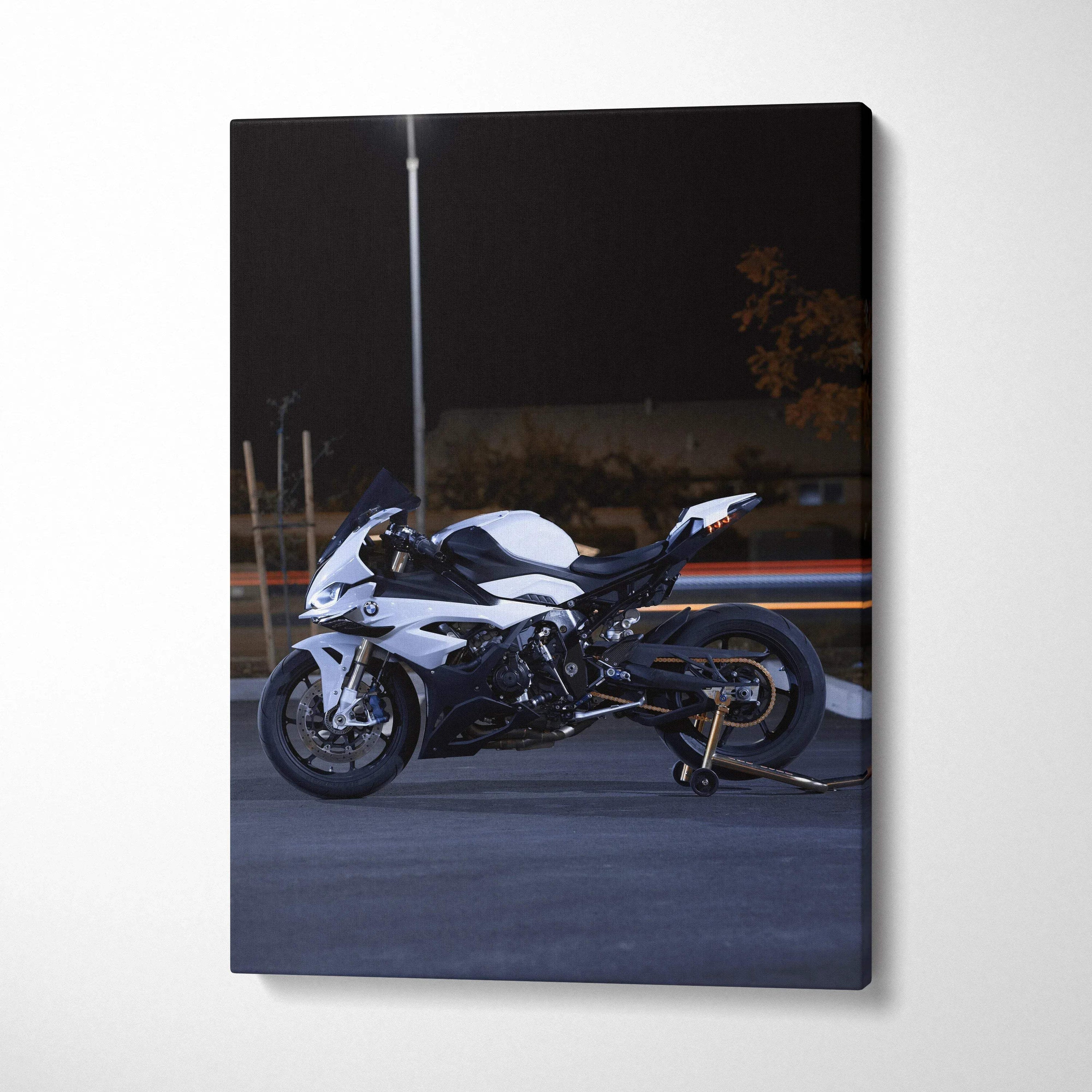 BMW S1000RR motorcycle on road at night canvas wall art with dark background.