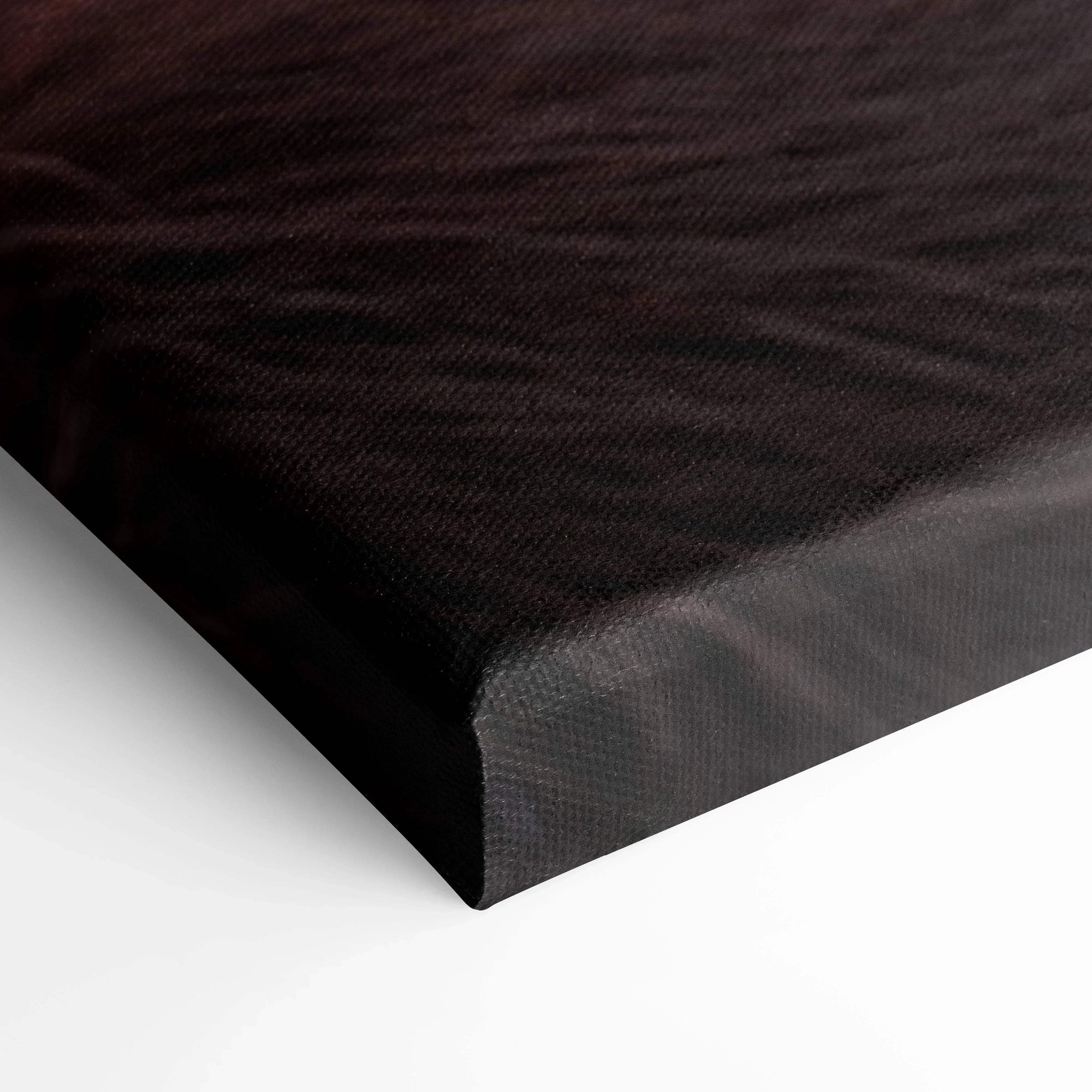 Close-up of a black textured canvas corner with crisp edges, showcasing high-quality wall art material.