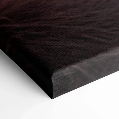 Close-up of a black textured canvas corner with crisp edges, showcasing high-quality wall art material.