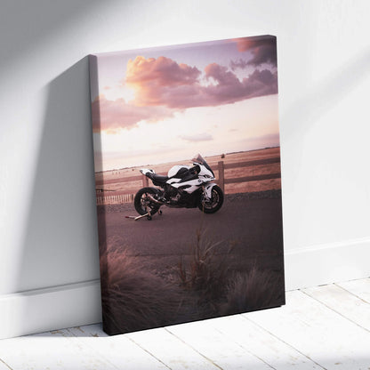 BMW S1000RR motorcycle at sunset on vertical canvas wall art with soft purple sky.