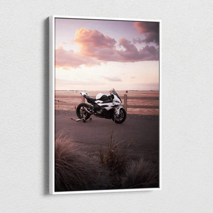 BMW S1000RR motorcycle canvas wall art with sunset sky and coastal landscape.