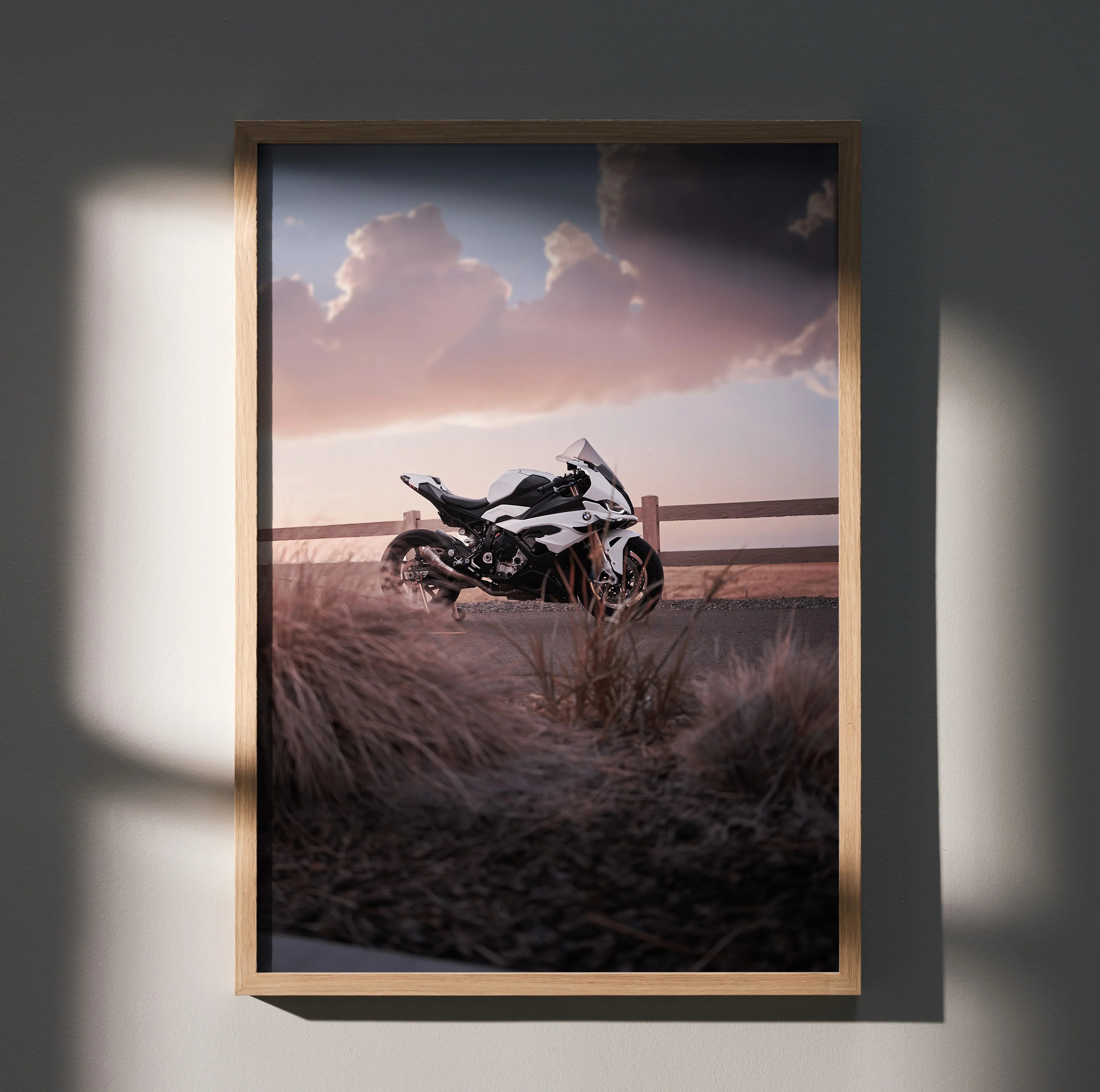 BMW S1000RR motorcycle poster with sunset sky and grassy field, framed wall art.